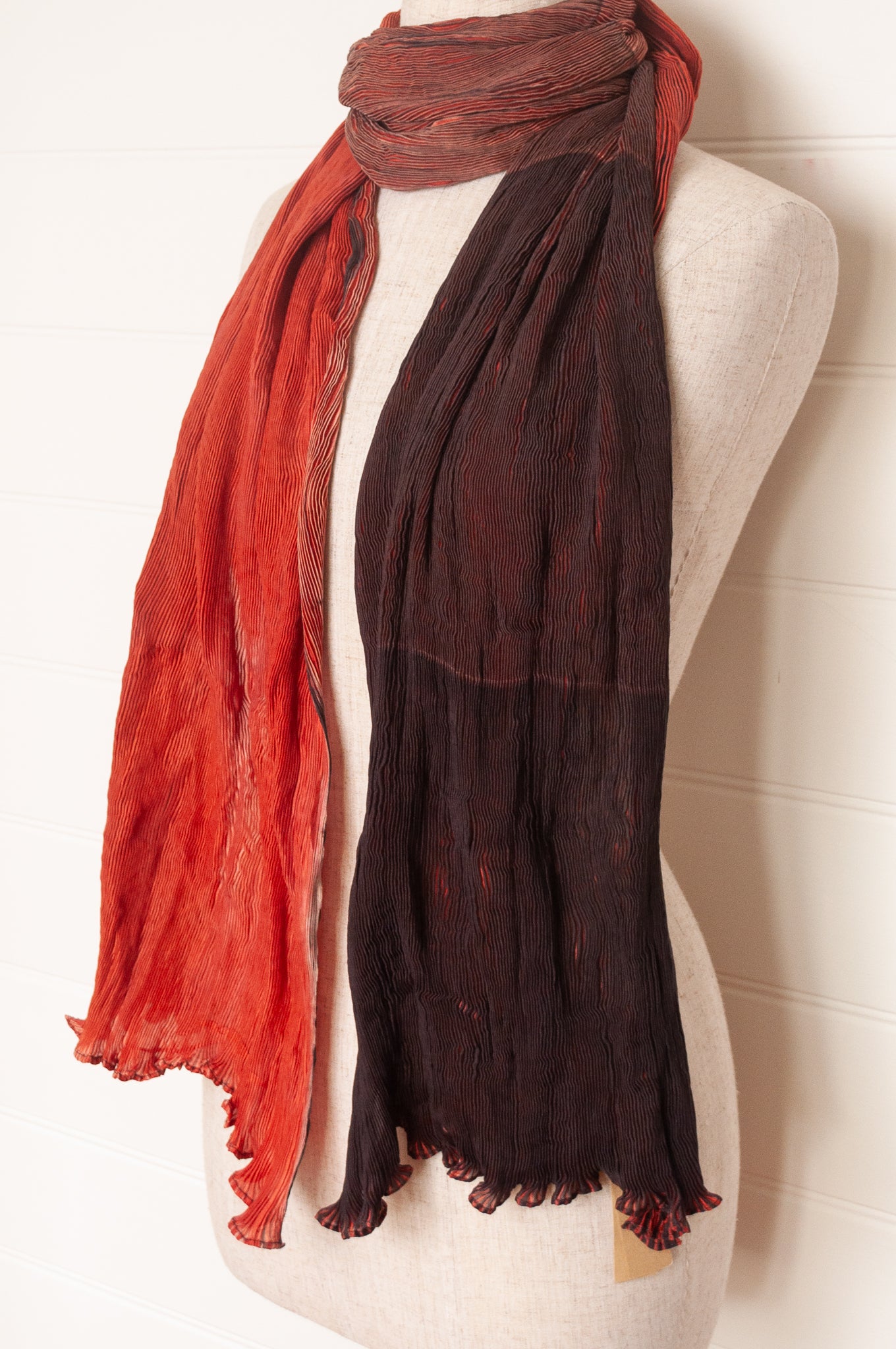 Neeru Kumar crinkle silk shibori scarf in pomegranate shades of red.