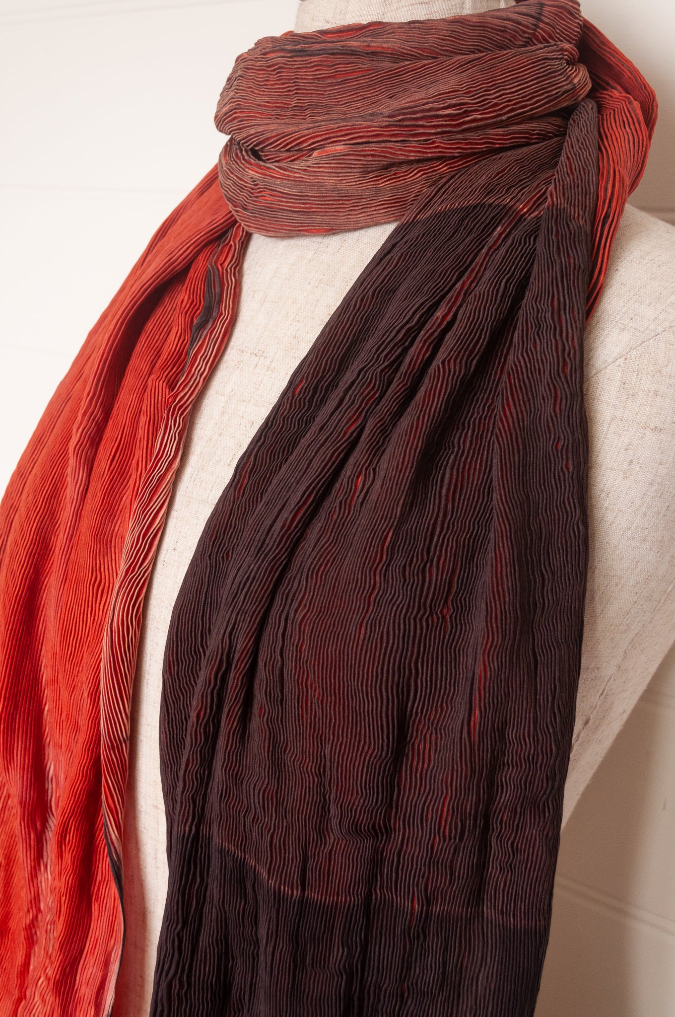 Neeru Kumar crinkle silk shibori scarf in pomegranate shades of red.
