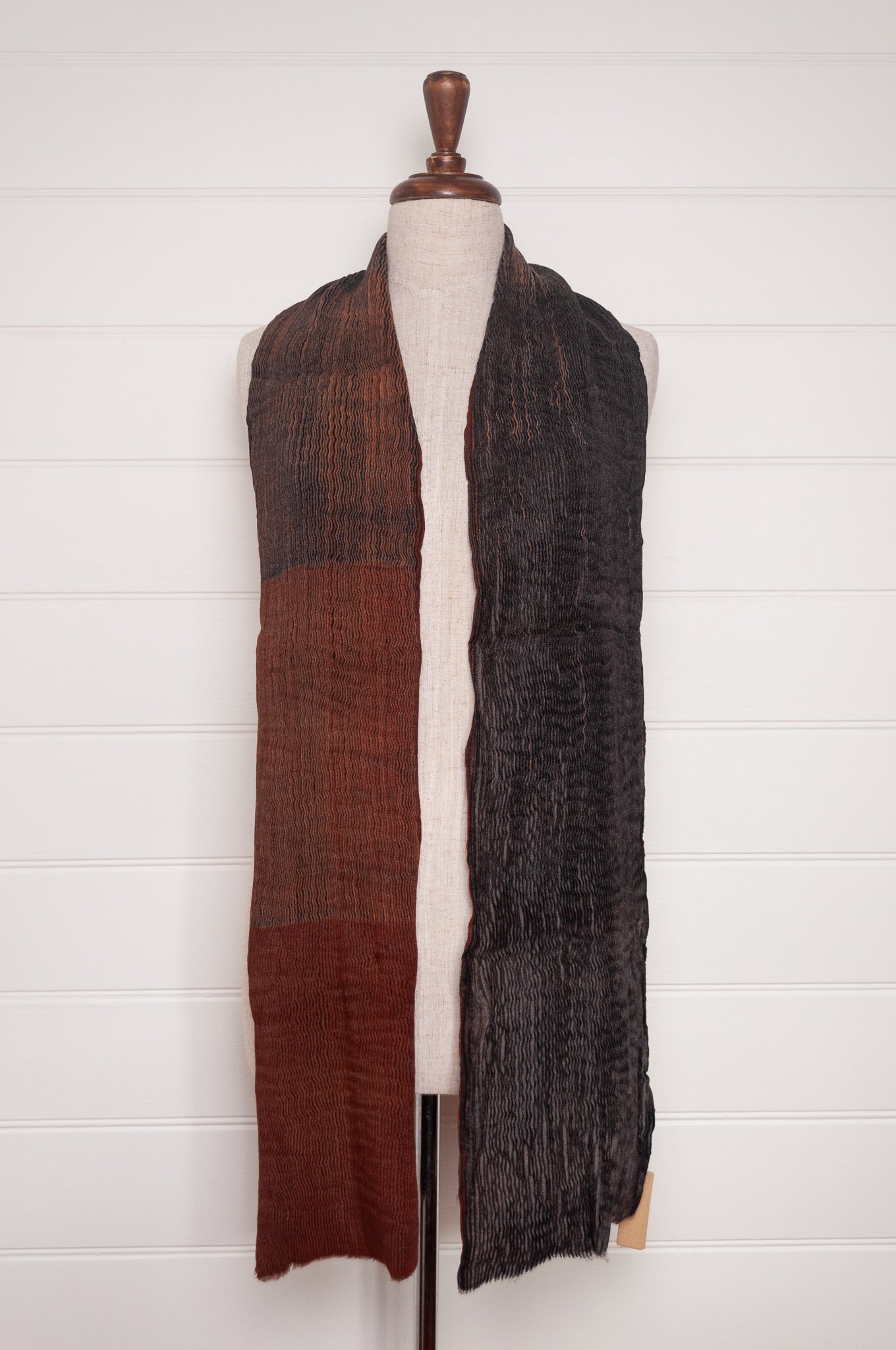 NK Shibori dyed wool scarf in chestnut brown and charocal, pleat finish.