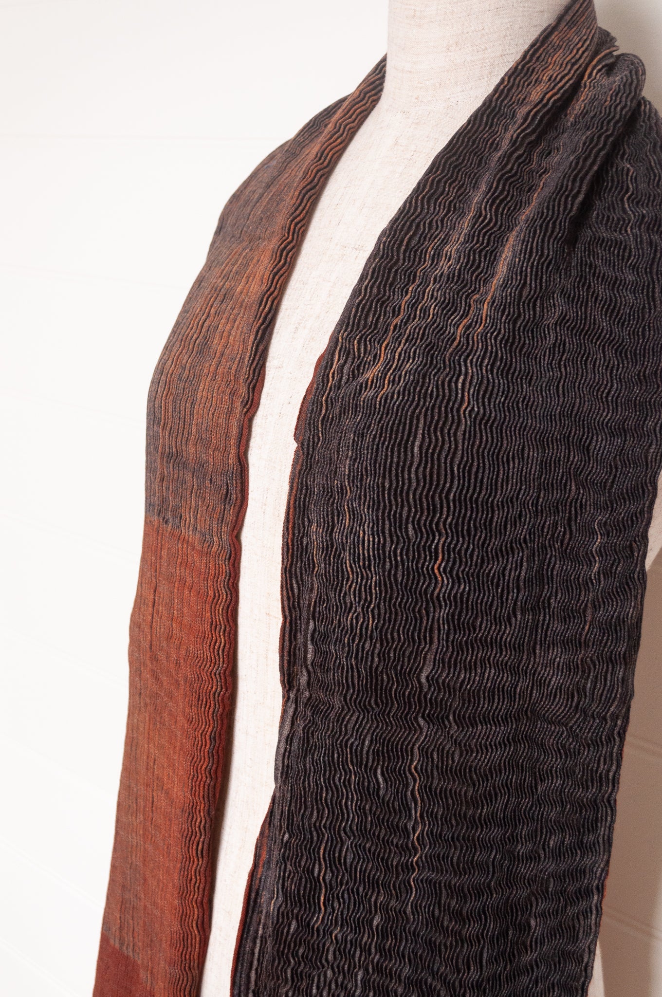 NK Shibori dyed wool scarf in chestnut brown and charocal, pleat finish.