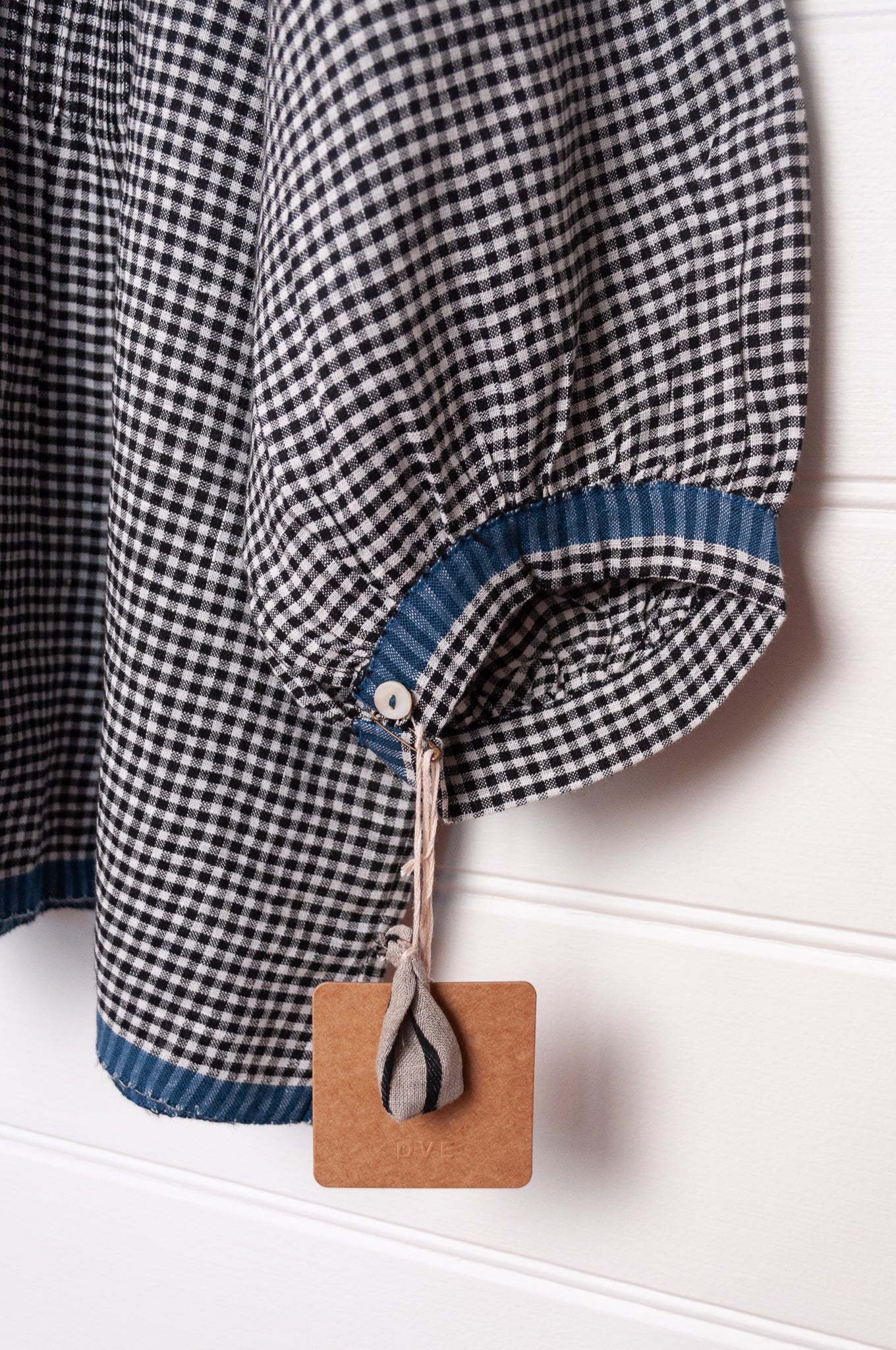 DVE Anisha pintucked top in black and white gingham check linen hand stitched details and blue selvedge.