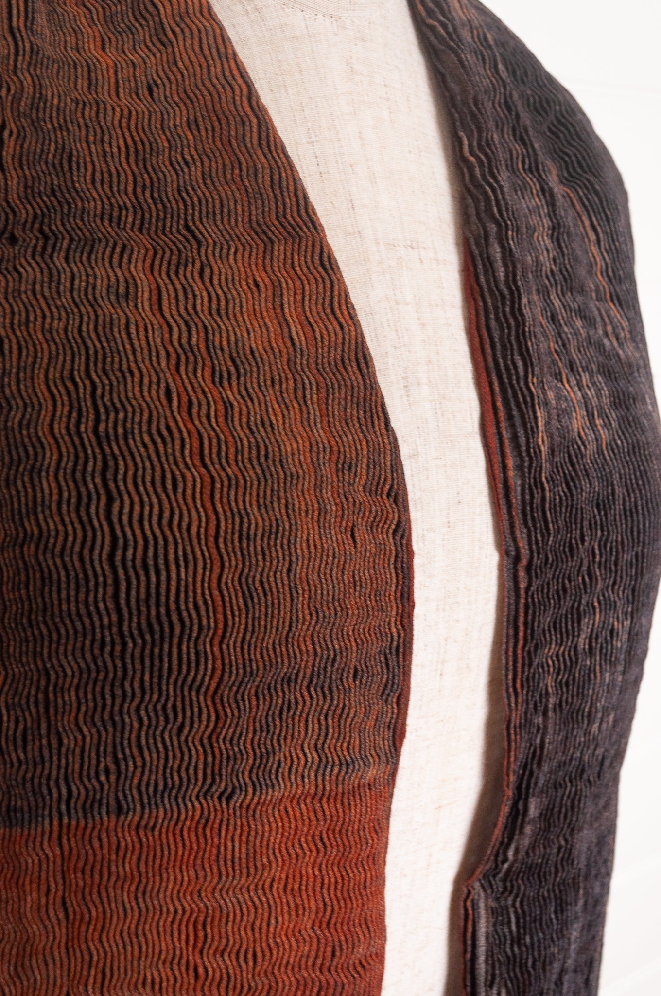 NK Shibori dyed wool scarf in chestnut brown and charocal, pleat finish.