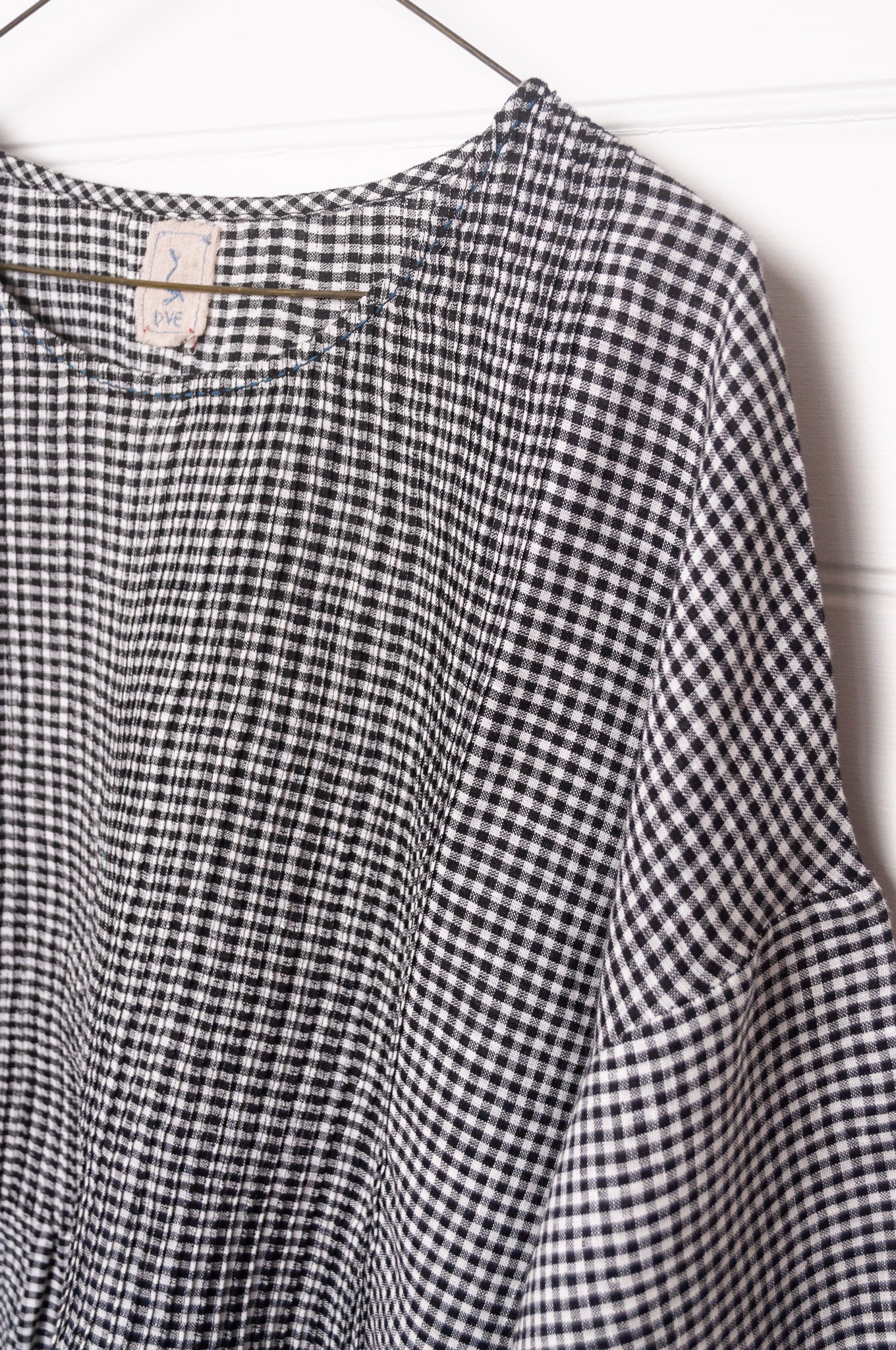 DVE Anisha pintucked top in black and white gingham check linen hand stitched details and blue selvedge.