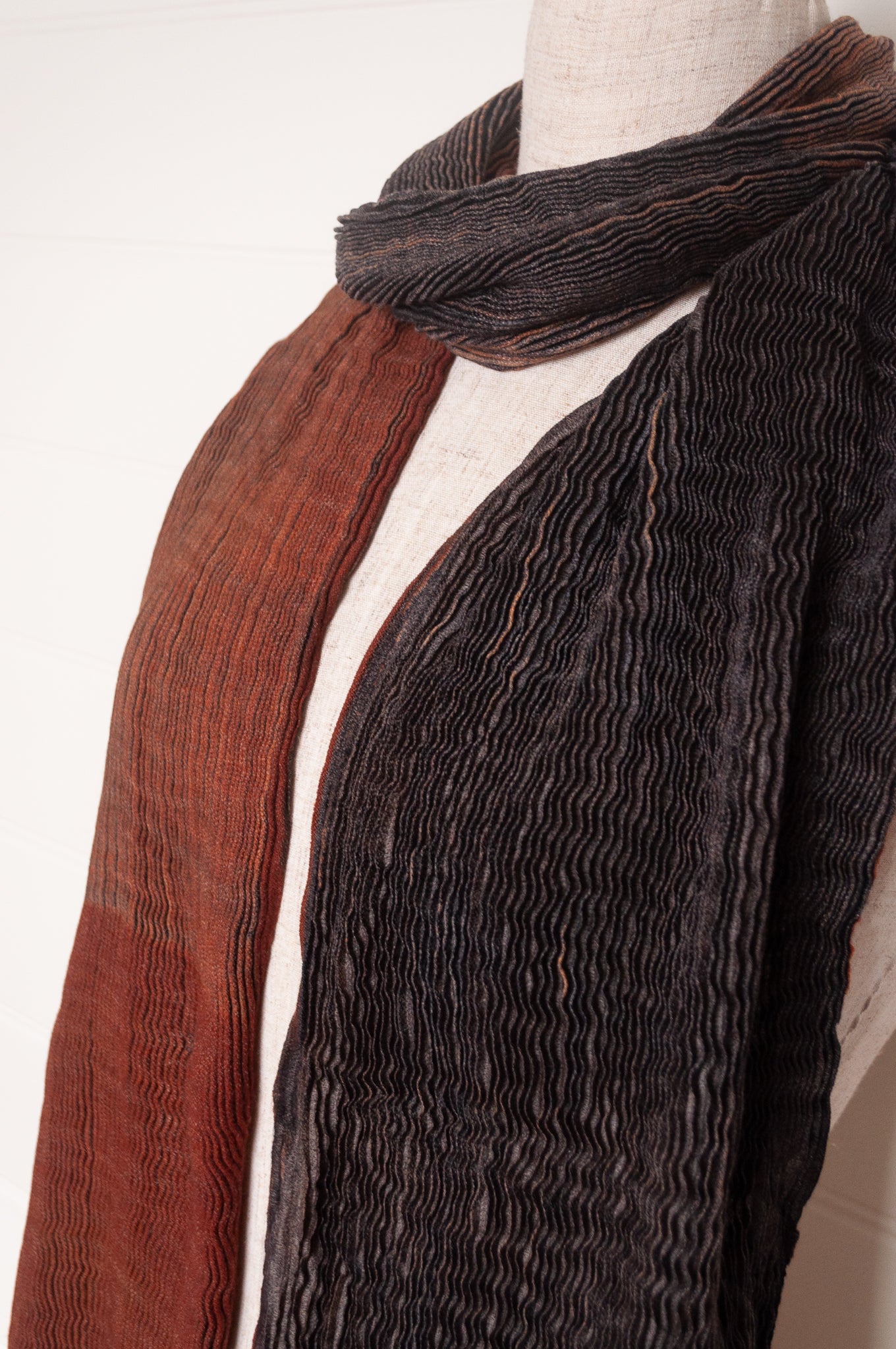 NK Shibori dyed wool scarf in chestnut brown and charocal, pleat finish.