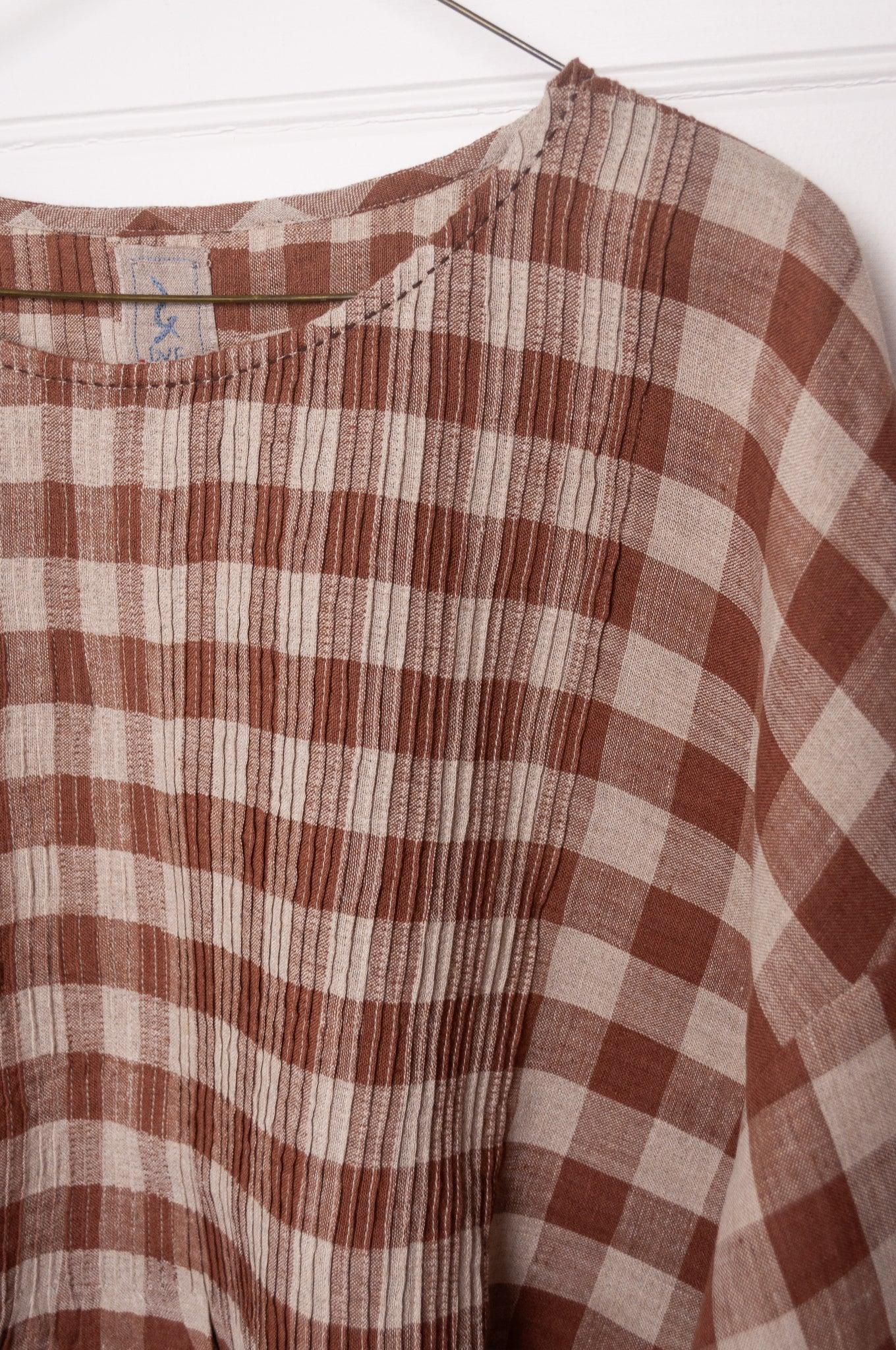 DVE Anisha pintucked top in French beige brown and white check linen hand stitched details.