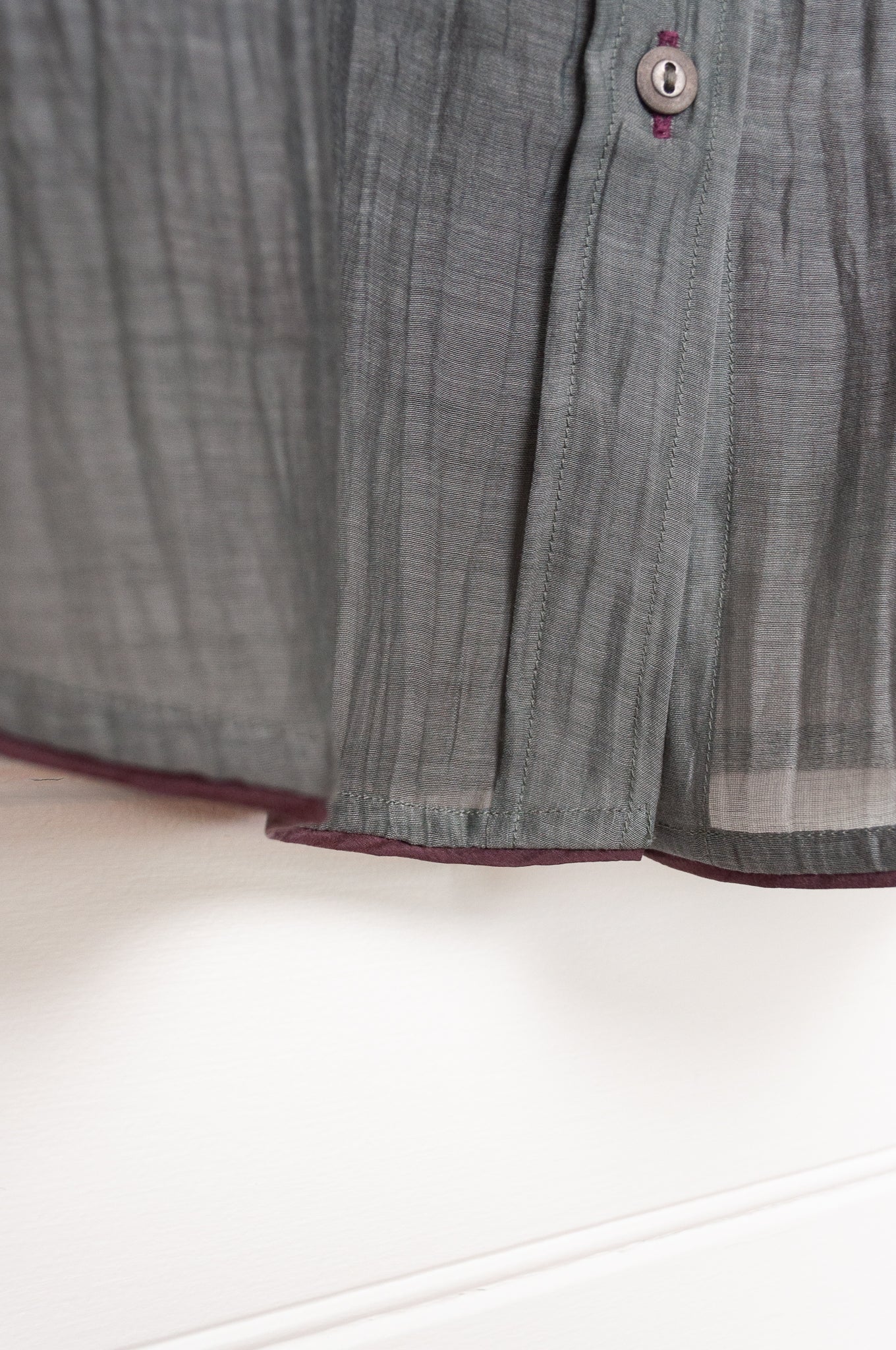 Manan cotton silk longline button up shirt in pewter grey with brown silk camisole.