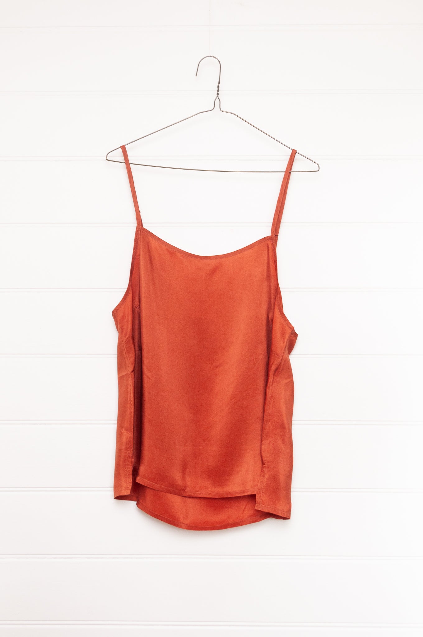 Manan lightweight cotton silk long sleeve button up shirt in magenta pink with orange silk camisole.