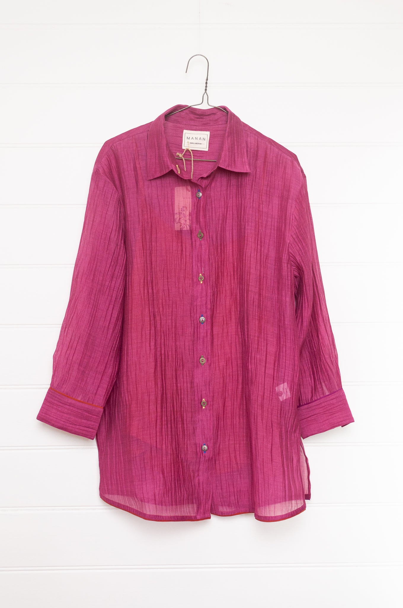 Manan lightweight cotton silk long sleeve button up shirt in magenta pink with orange silk camisole.