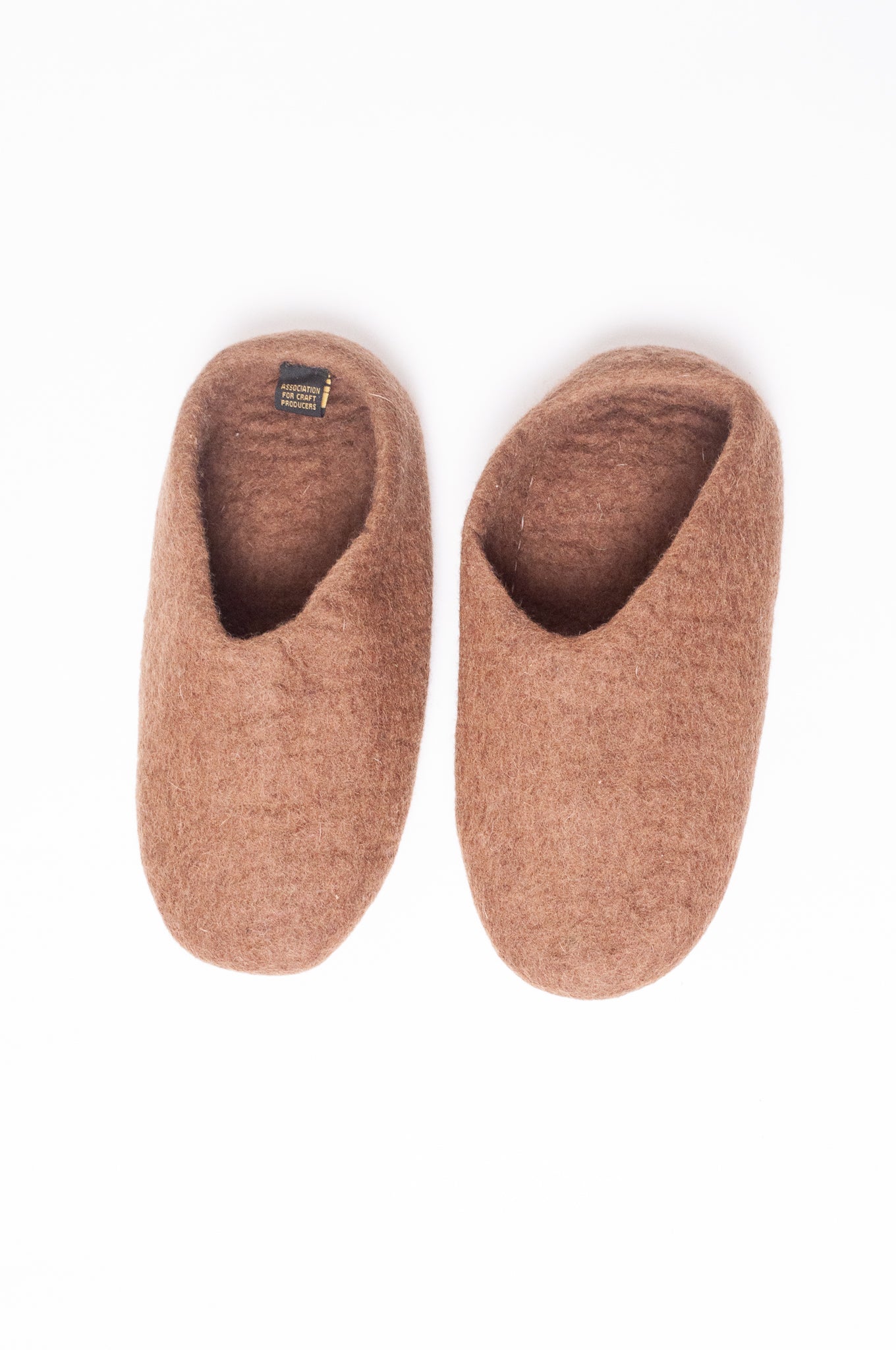 Wool felt slip on slippers in brown.