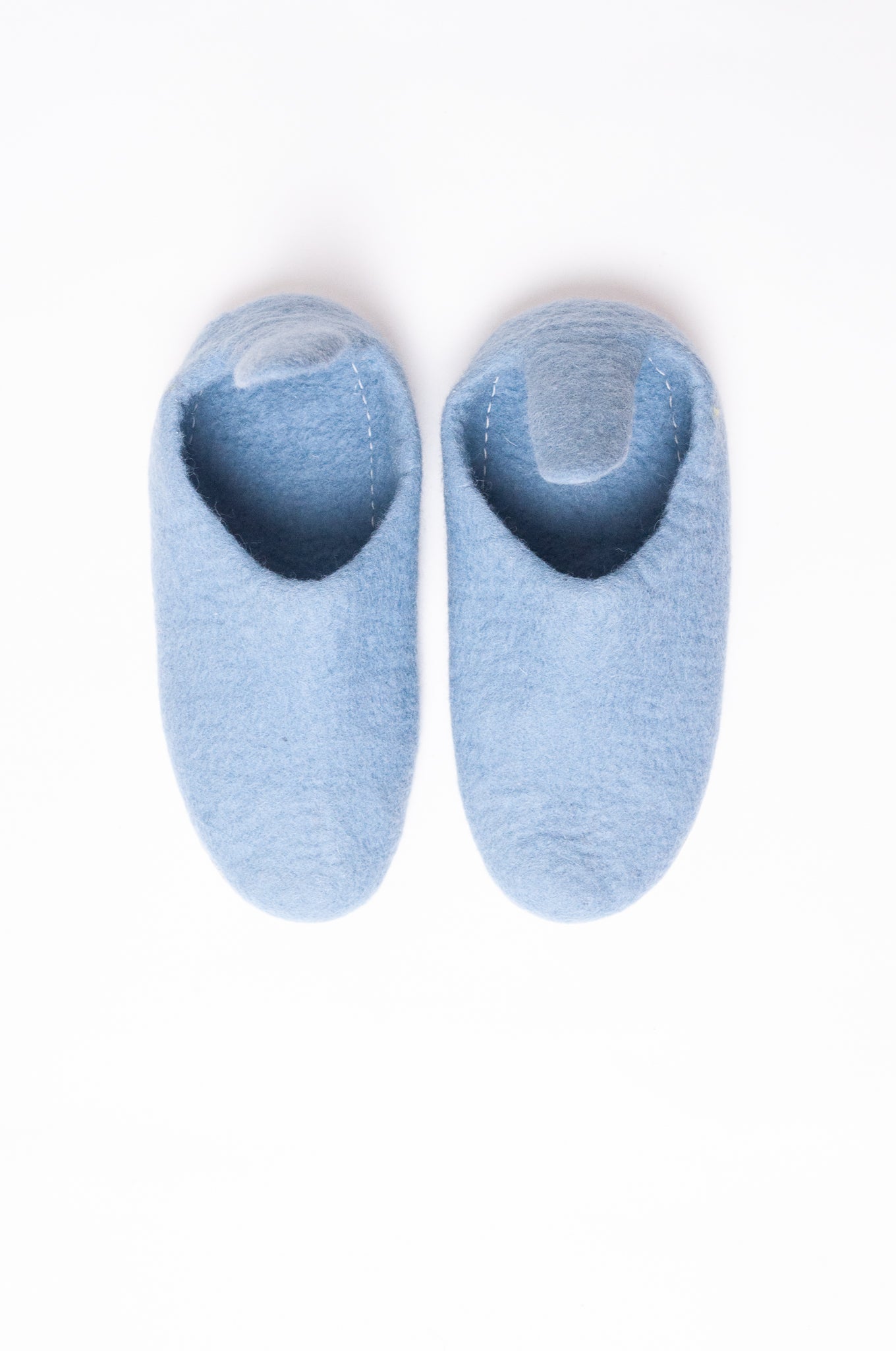 Wool felt pull on slippers in baby blue.