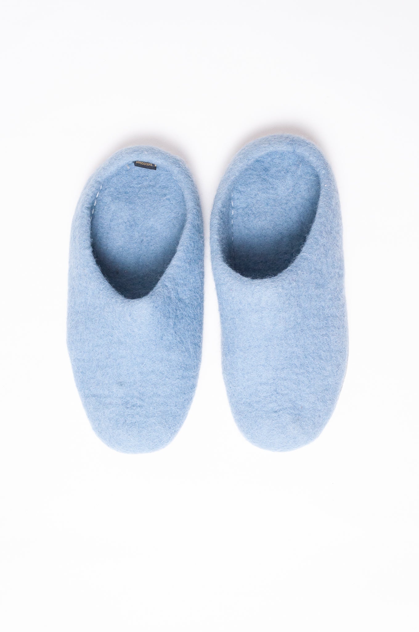 Wool felt slip on slippers in baby blue.
