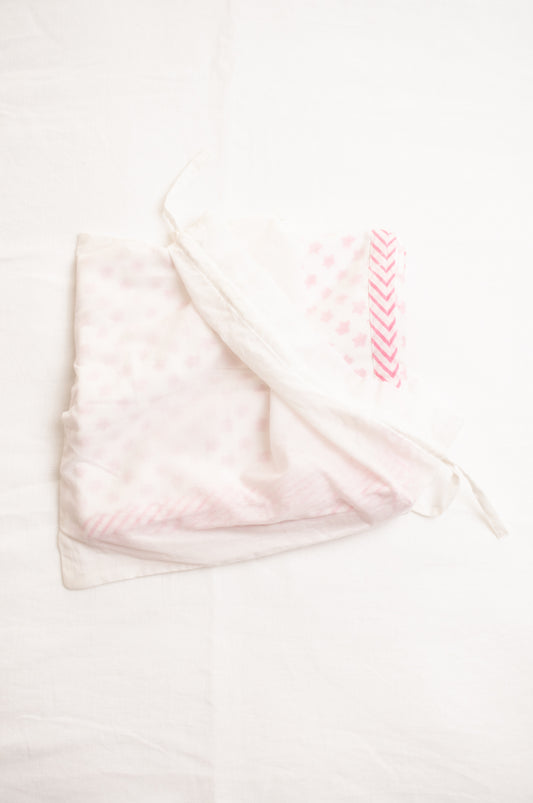 Baby dohar cot size cotton muslin block print pink stars on white.