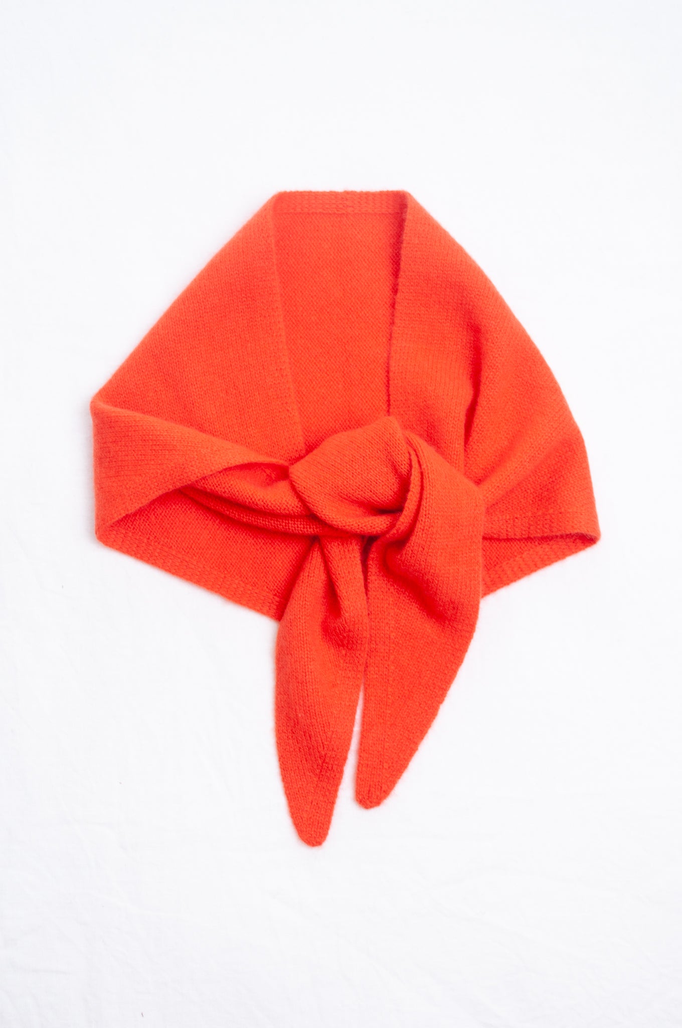 Cashmere triangle neck scarf in tangerine red orange.