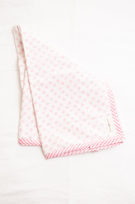 Baby dohar cot size cotton muslin block print pink stars on white.