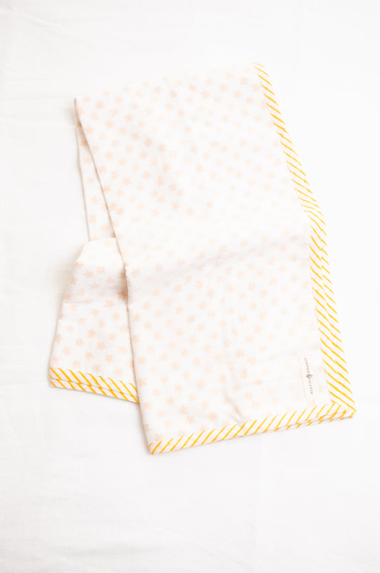 Baby dohar cot size cotton muslin block print yellow stars on white.