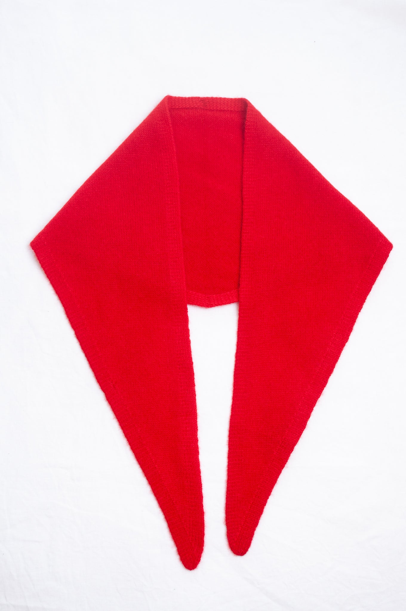 Cashmere triangle neck scarf in tangerine red orange.