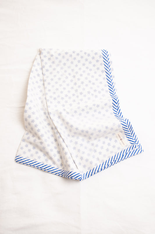 Baby dohar cot size cotton muslin block print blue stars on white.