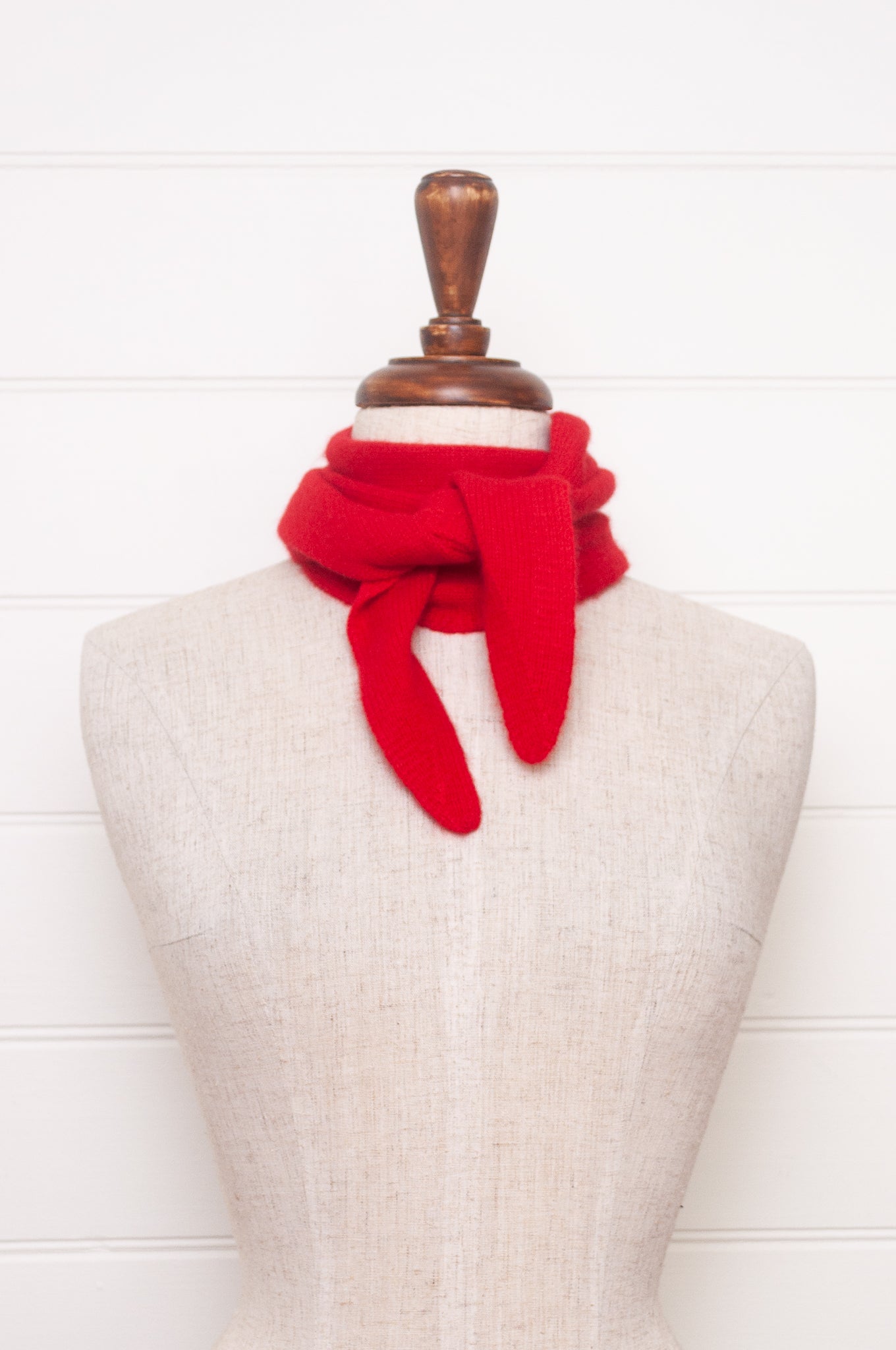 Cashmere triangle neck scarf in tangerine red orange.