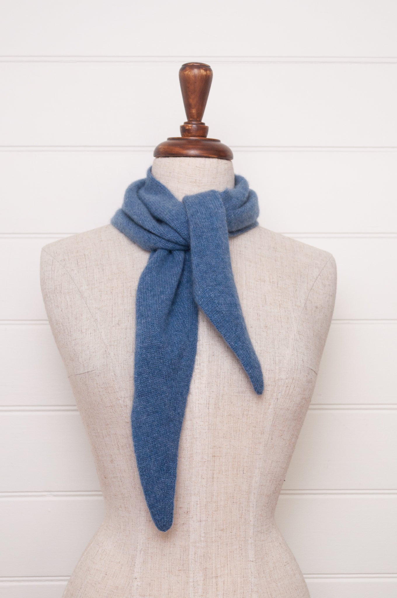Cashmere triangle neck scarf in denim blue.
