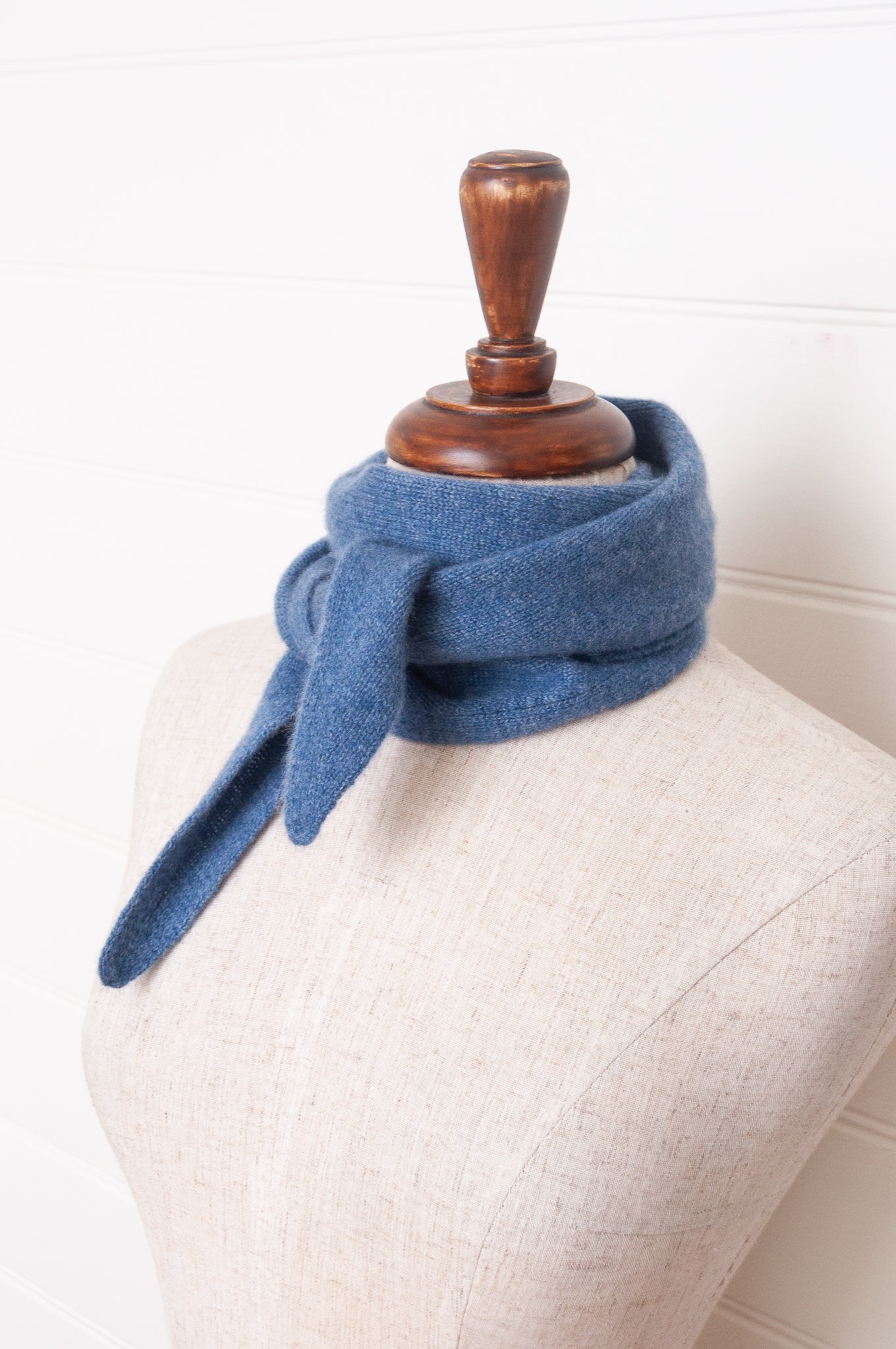 Cashmere triangle neck scarf in denim blue.