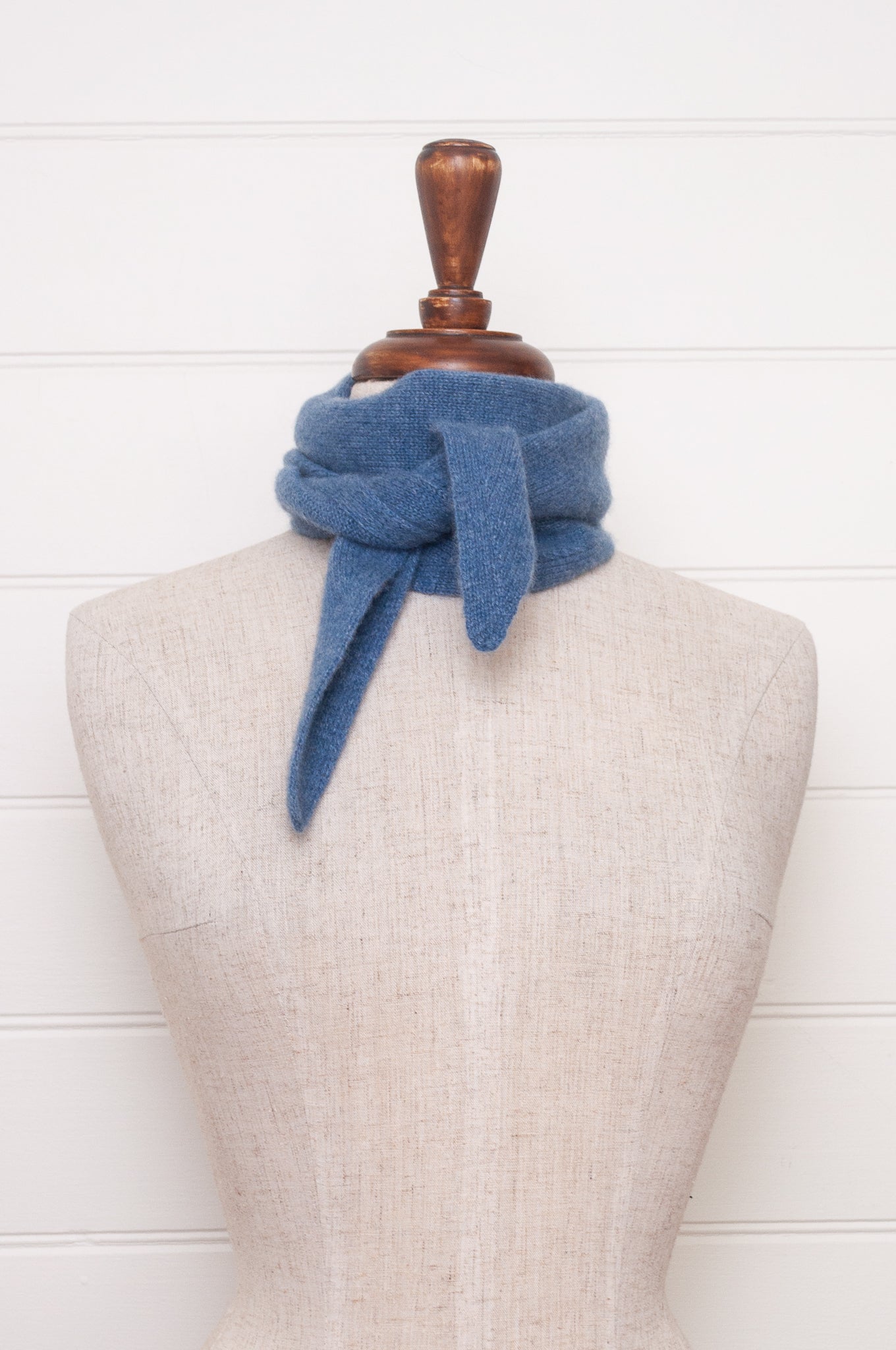 Cashmere triangle neck scarf in denim blue.