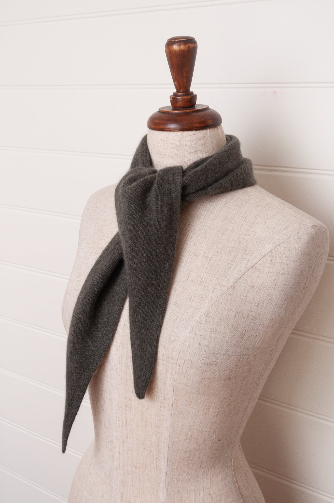 Cashmere triangle neck scarf in olive green.