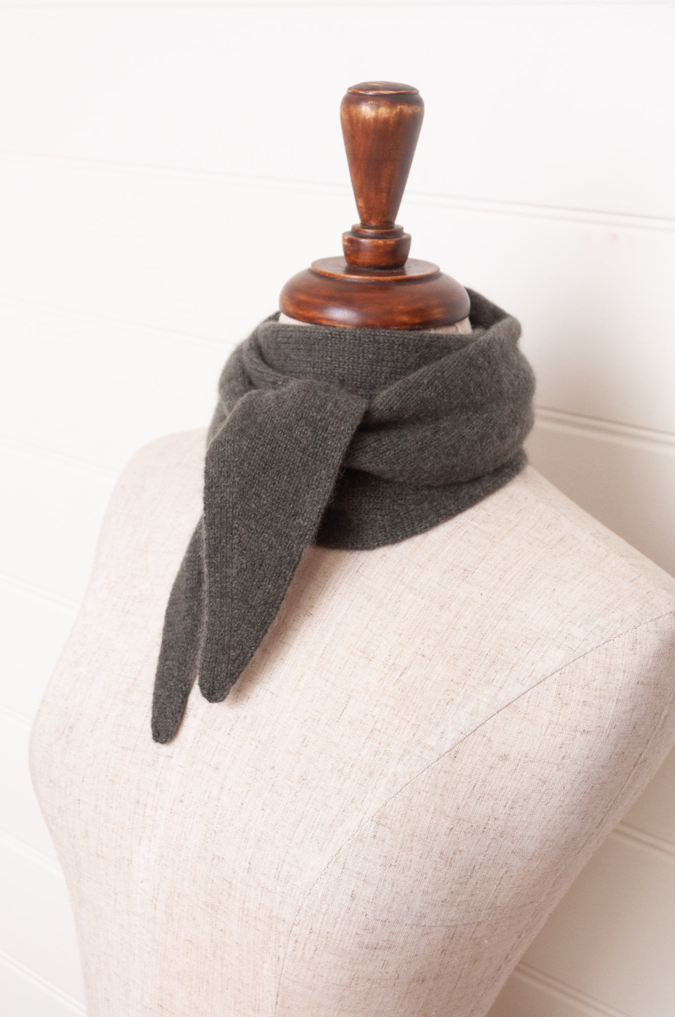 Cashmere triangle neck scarf in olive green.