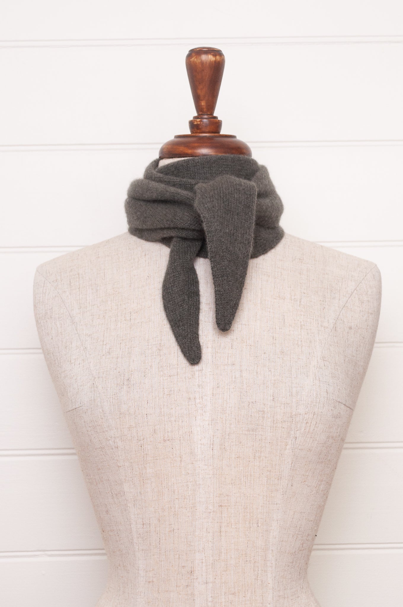 Cashmere triangle neck scarf in olive green.
