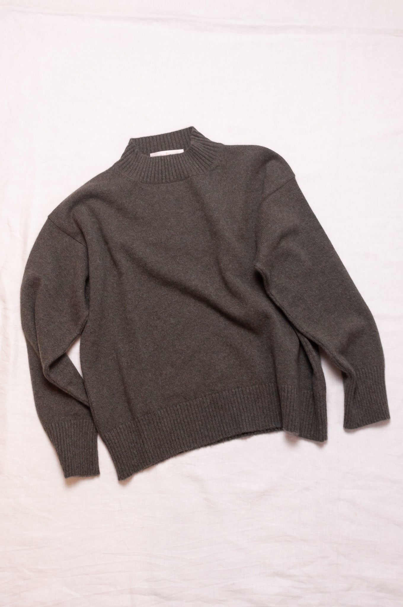 Cashmere turtle neck sweater in deep dusky olive green.