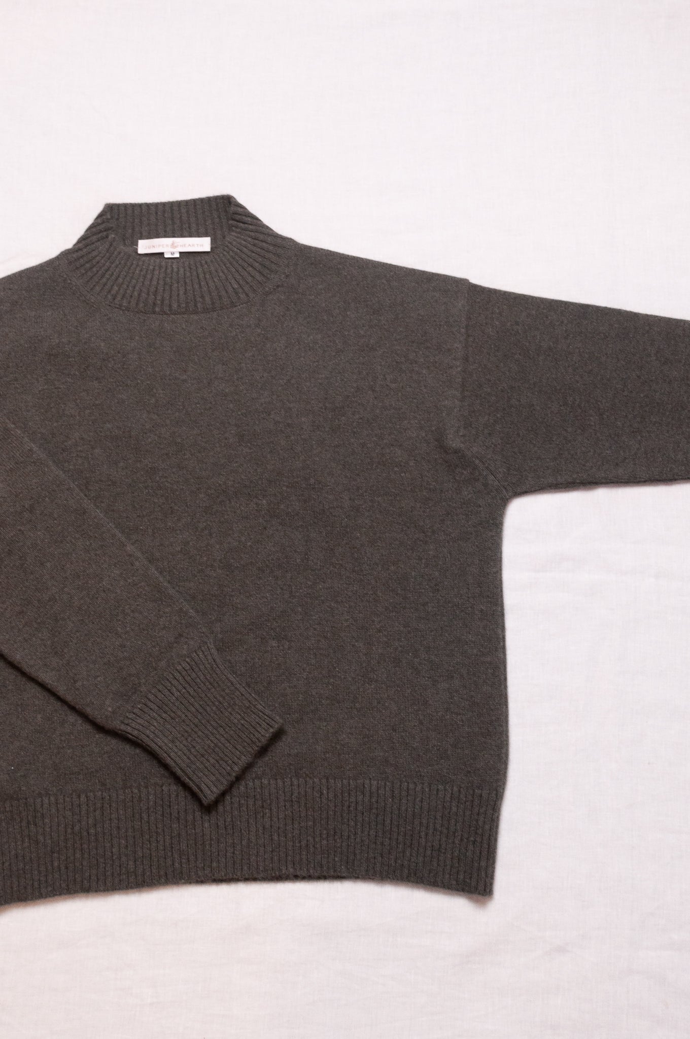 Cashmere turtle neck sweater in deep dusky olive green.