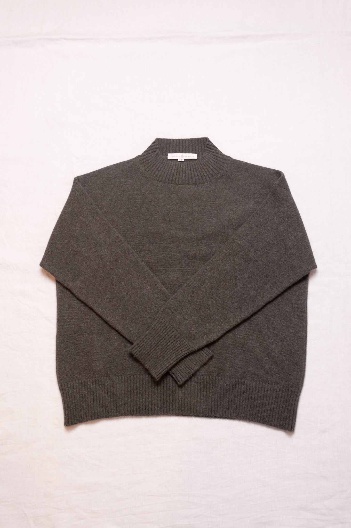 Cashmere turtle neck sweater in deep dusky olive green.