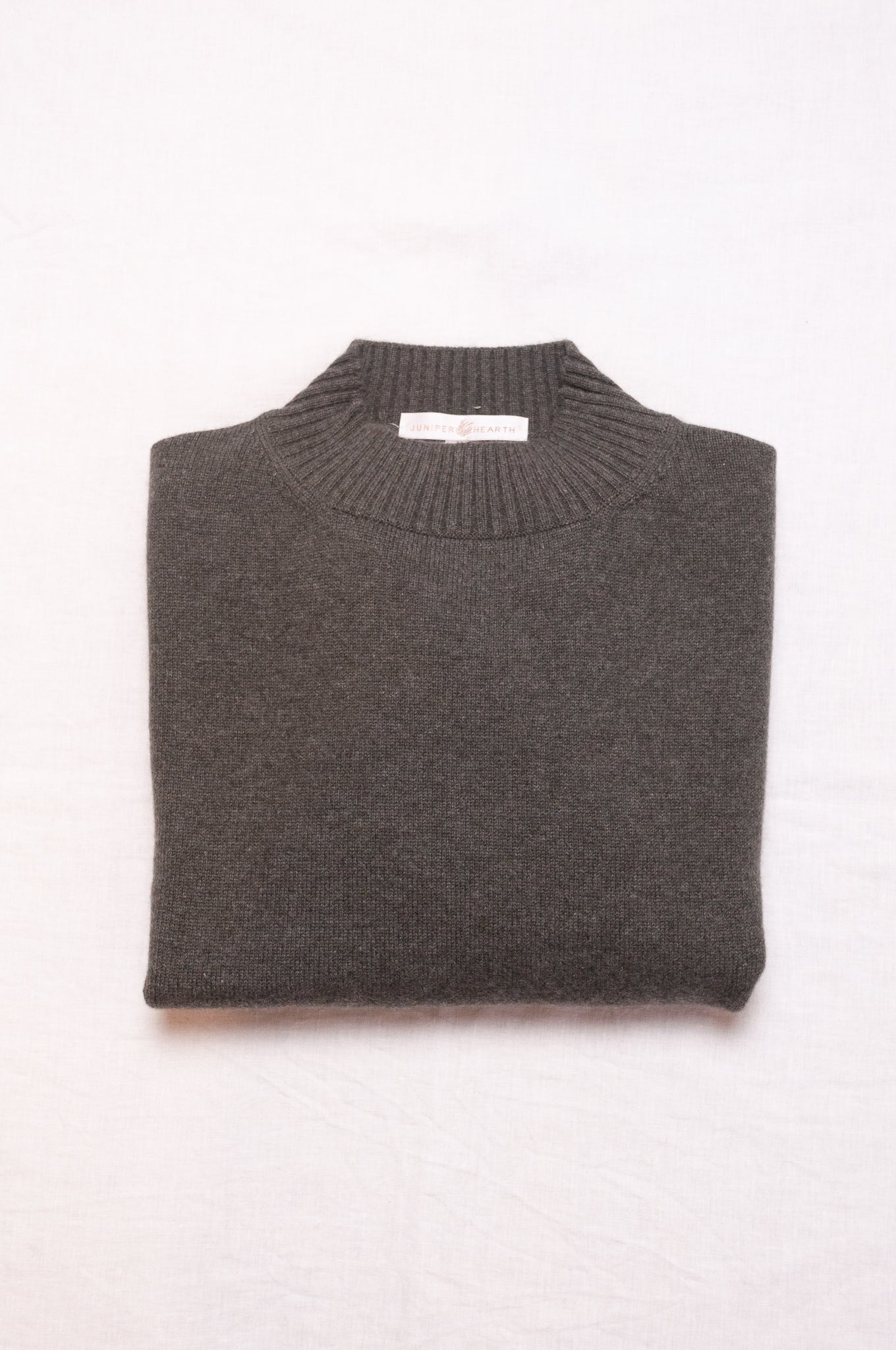 Cashmere turtle neck sweater in deep dusky olive green.