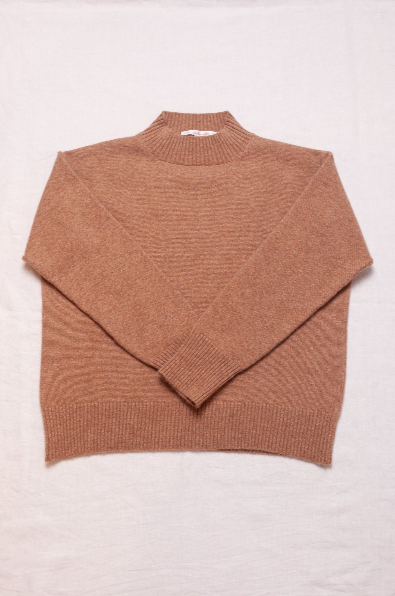 Cashmere turtle neck sweater in camel.