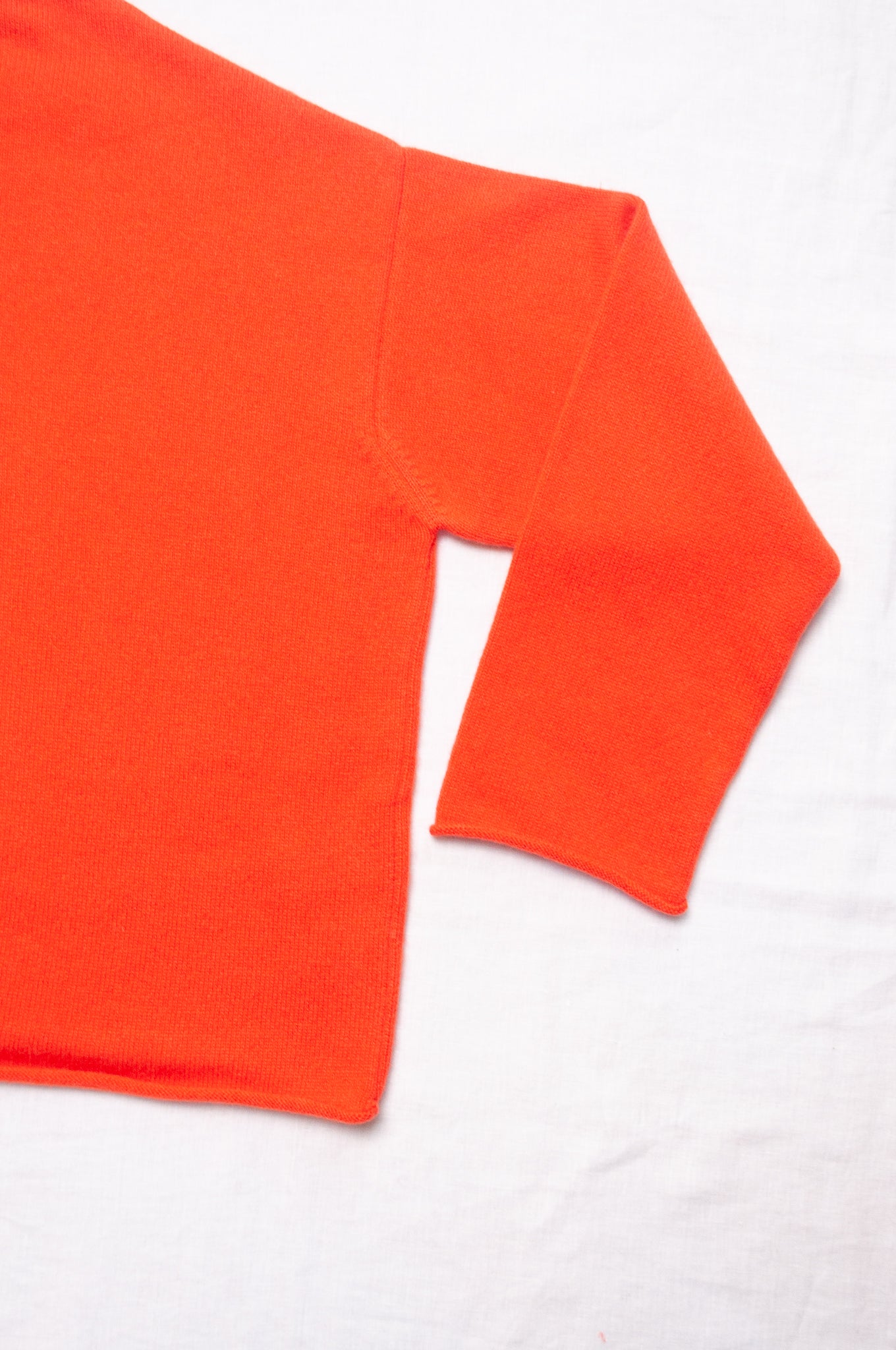One size reversible cashmere cardigan in tangerine red orange.