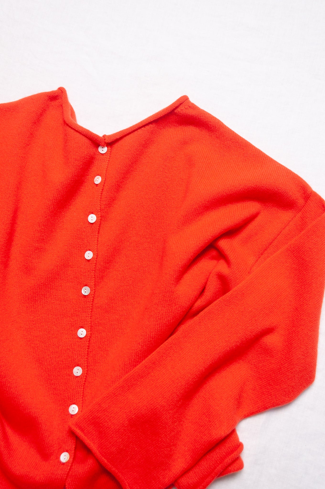 One size reversible cashmere cardigan in tangerine red orange.