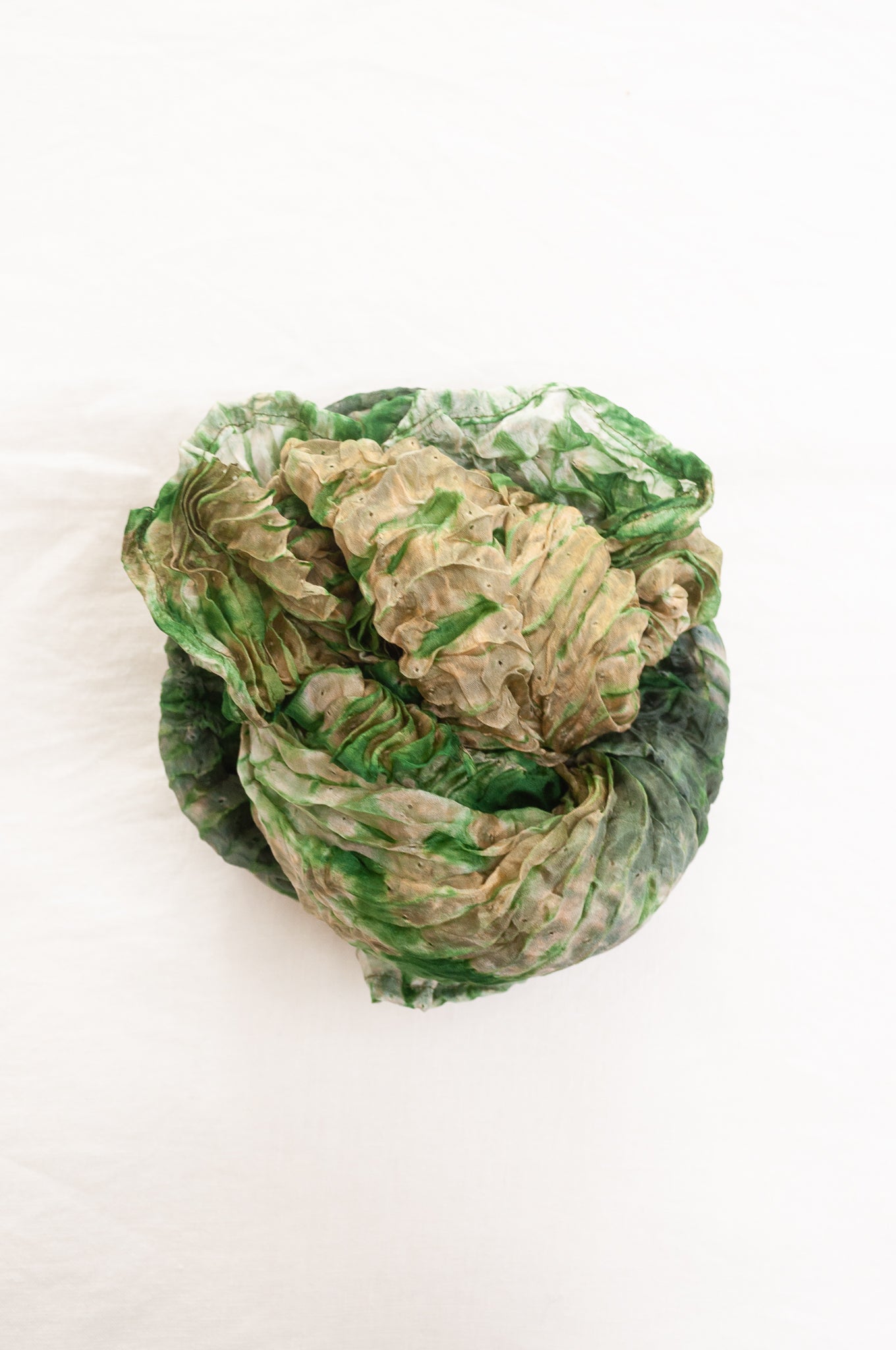 Shibori dyed pure silk crinkle finish scarf in pale bronze and green.