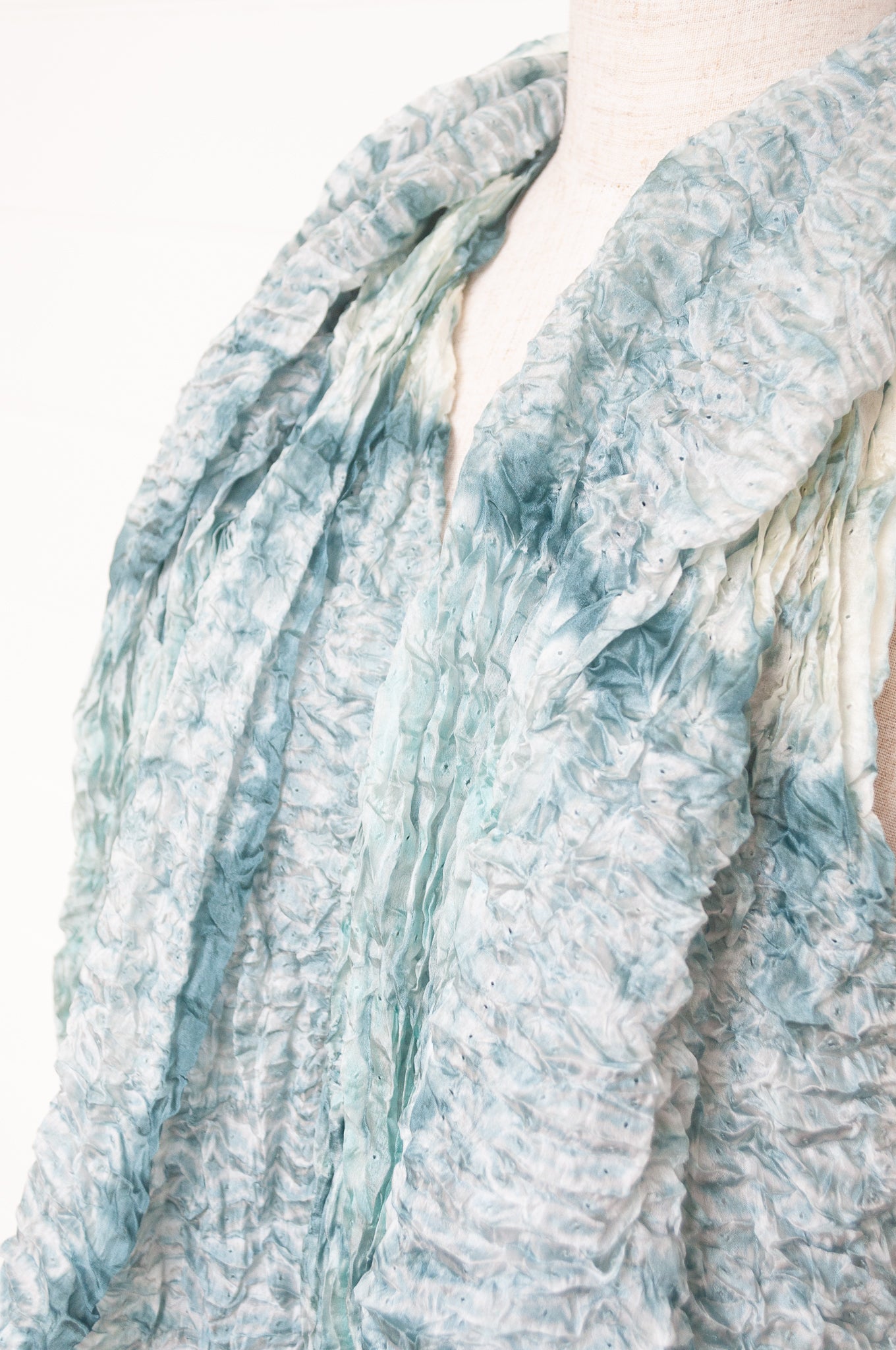 Shibori dyed pure silk crinkle finish scarf in pale blue and white.