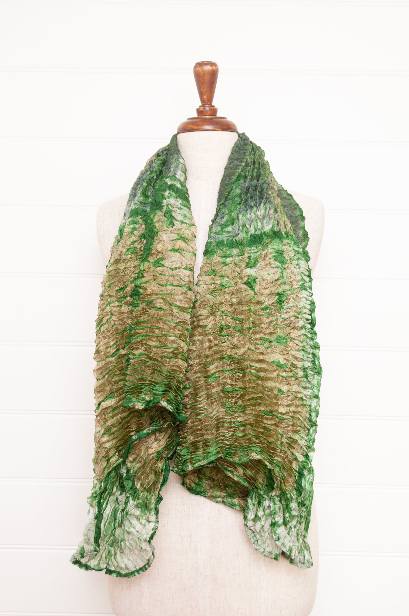 Shibori dyed pure silk crinkle finish scarf in pale bronze and green.