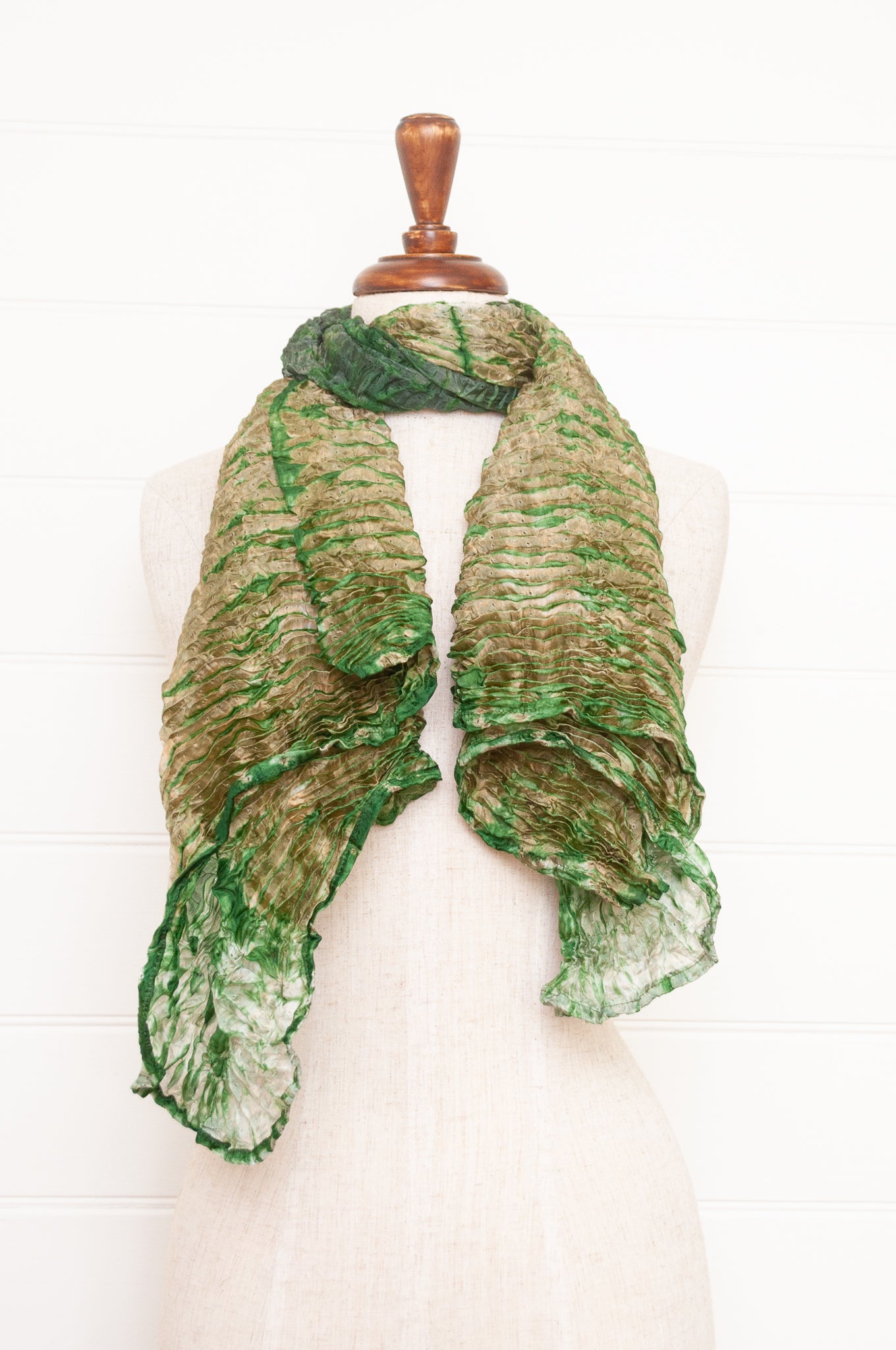Shibori dyed pure silk crinkle finish scarf in pale bronze and green.