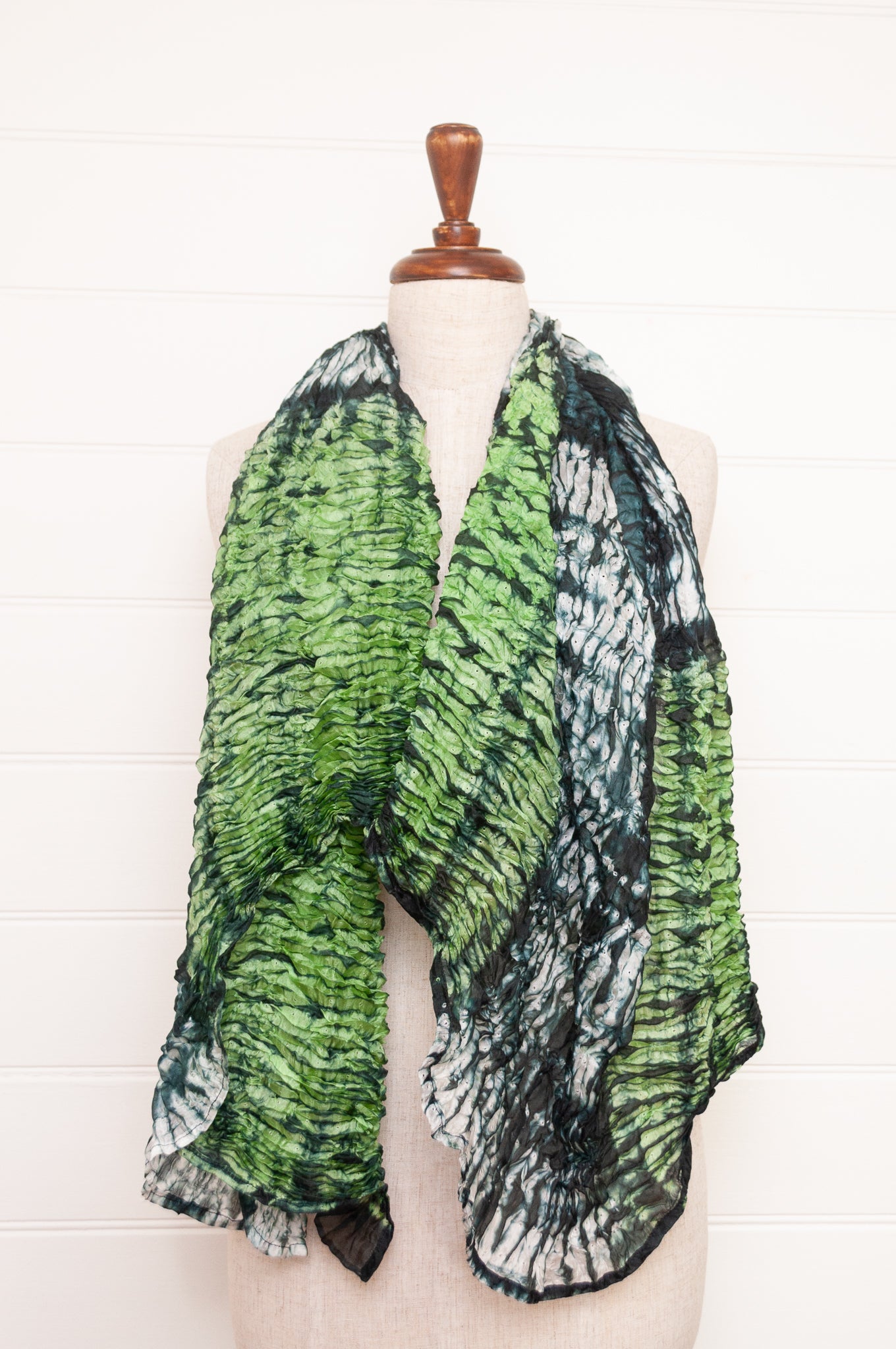 Shibori dyed pure silk crinkle finish scarf in shades of green, with stripes of navy and white.