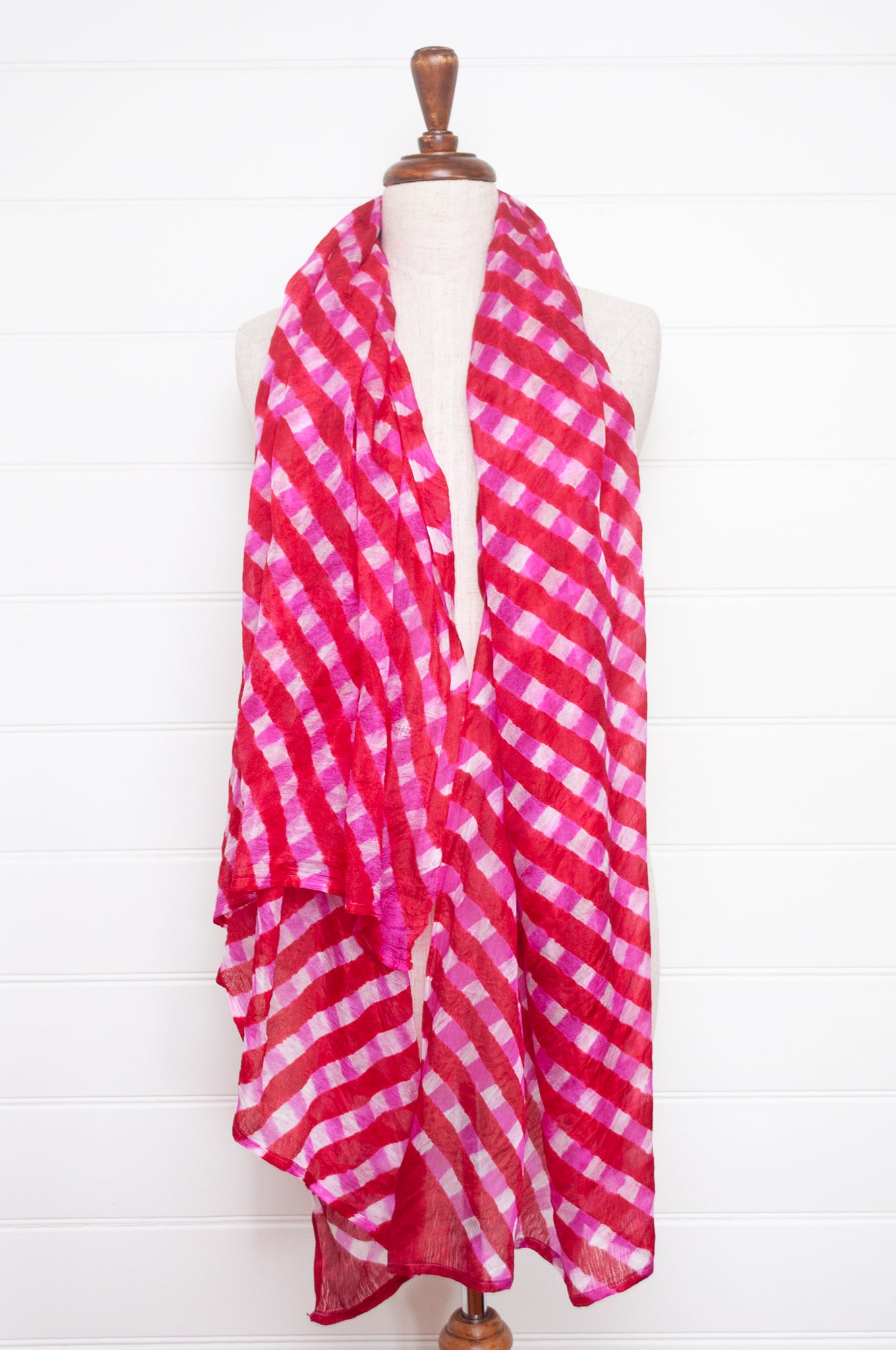 Hand painted pure silk scarf with deep pink checks on white.
