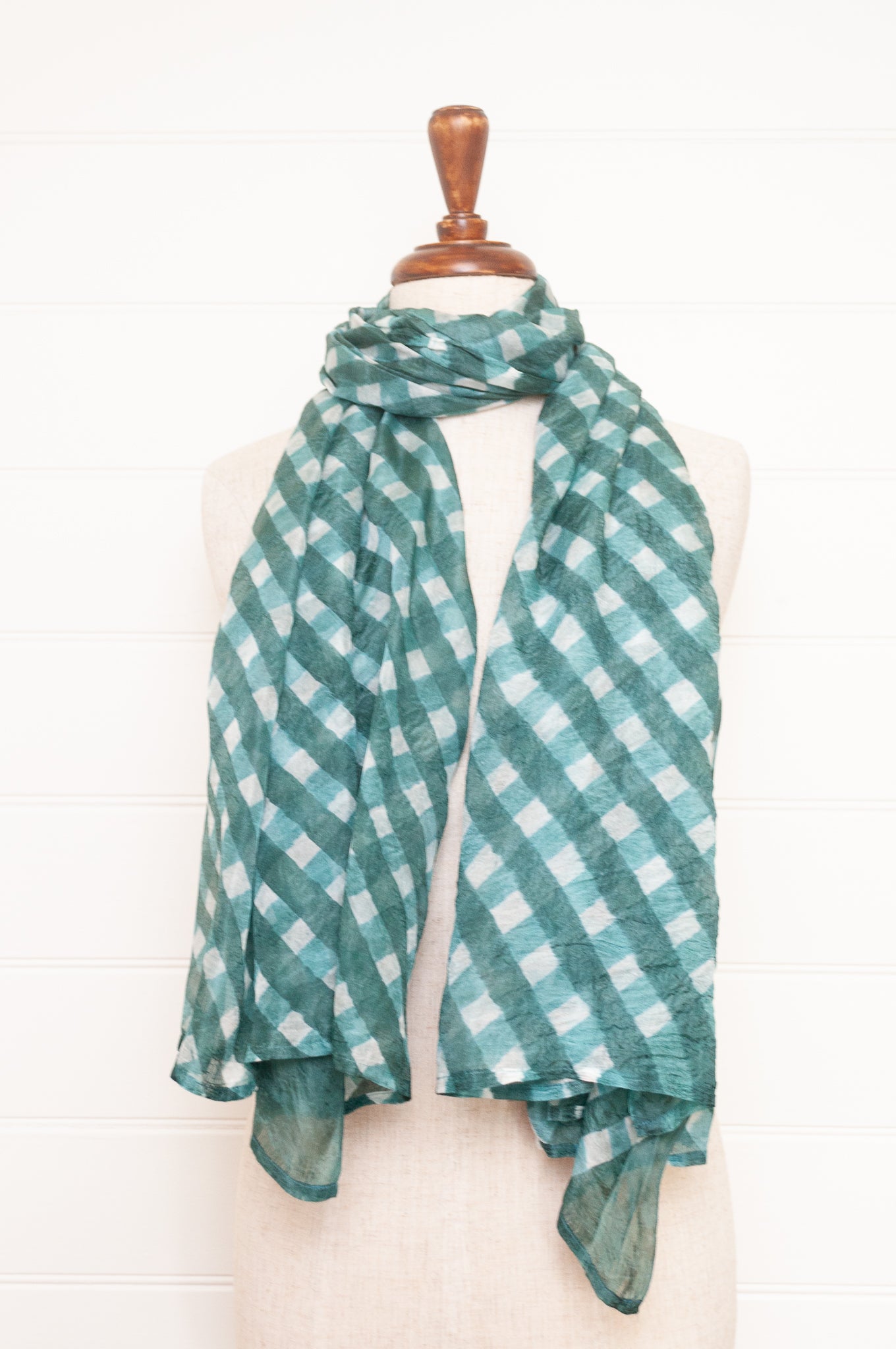 Hand painted pure silk scarf with deep turquoise green checks on white.