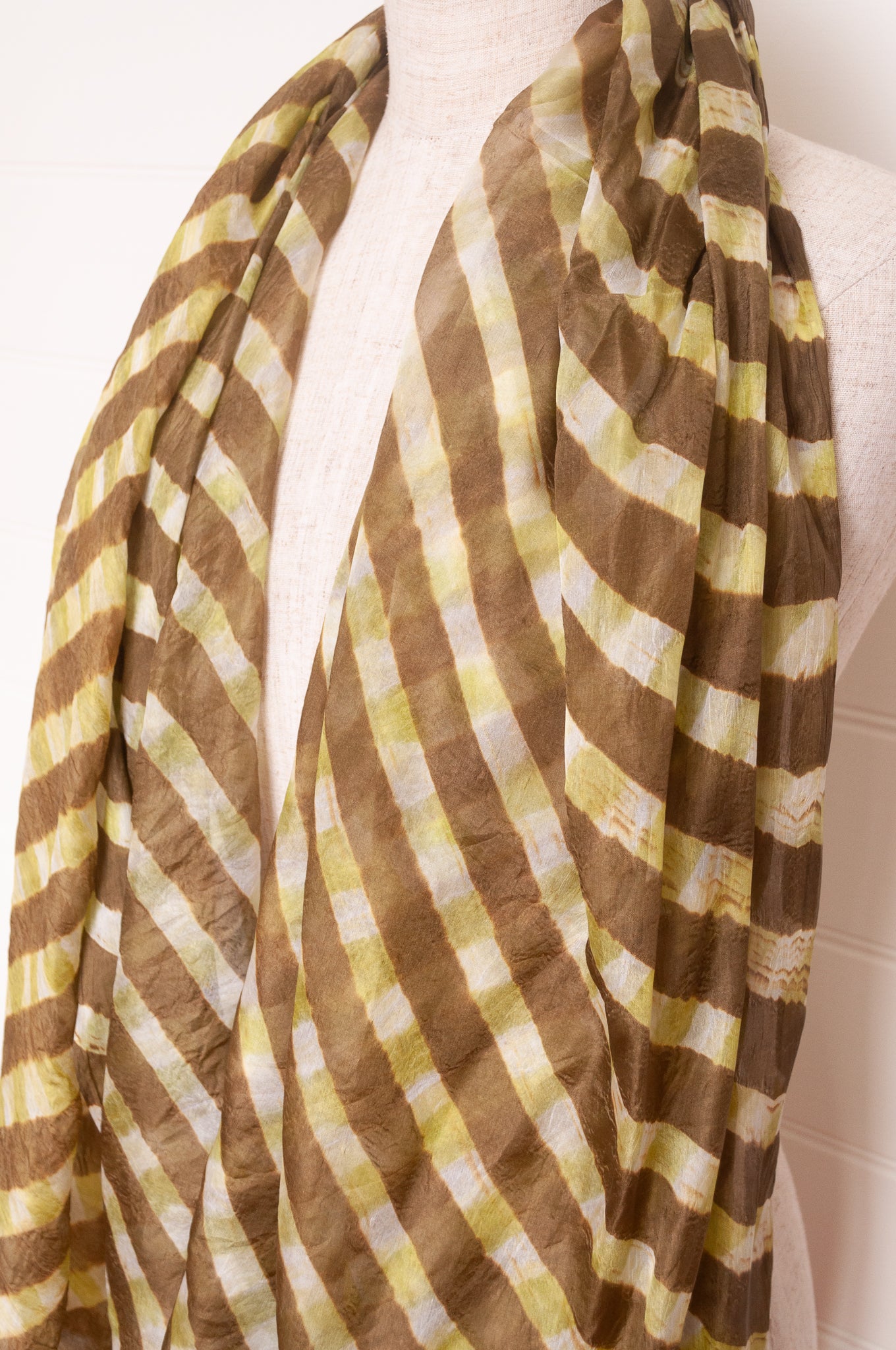Hand painted pure silk scarf with deep olive green checks on white.