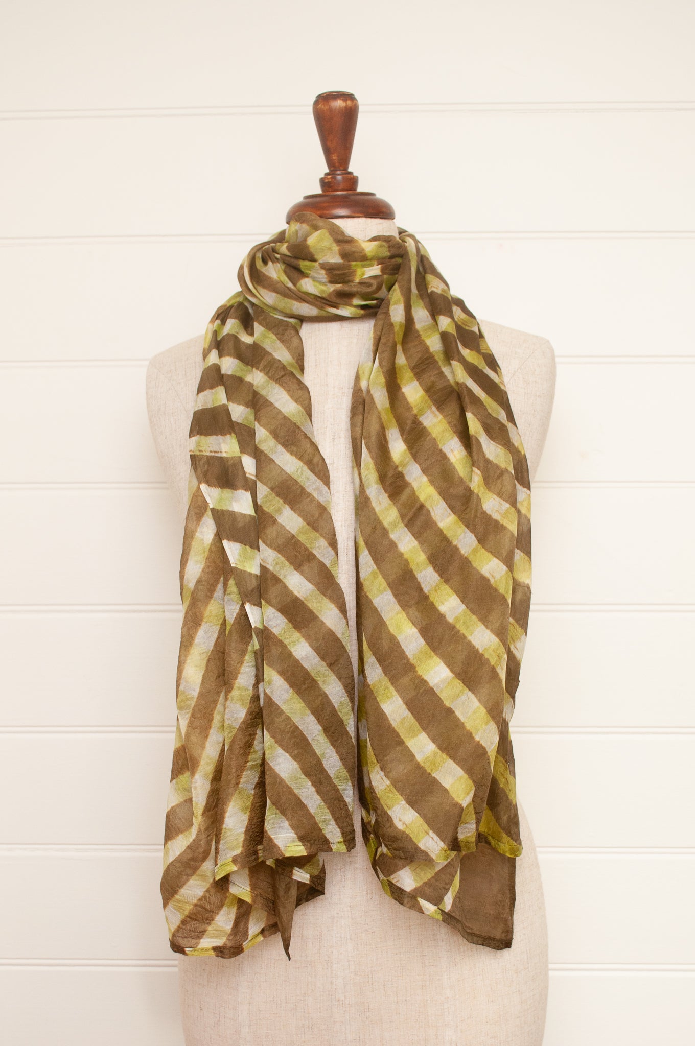 Hand painted pure silk scarf with deep olive green checks on white.