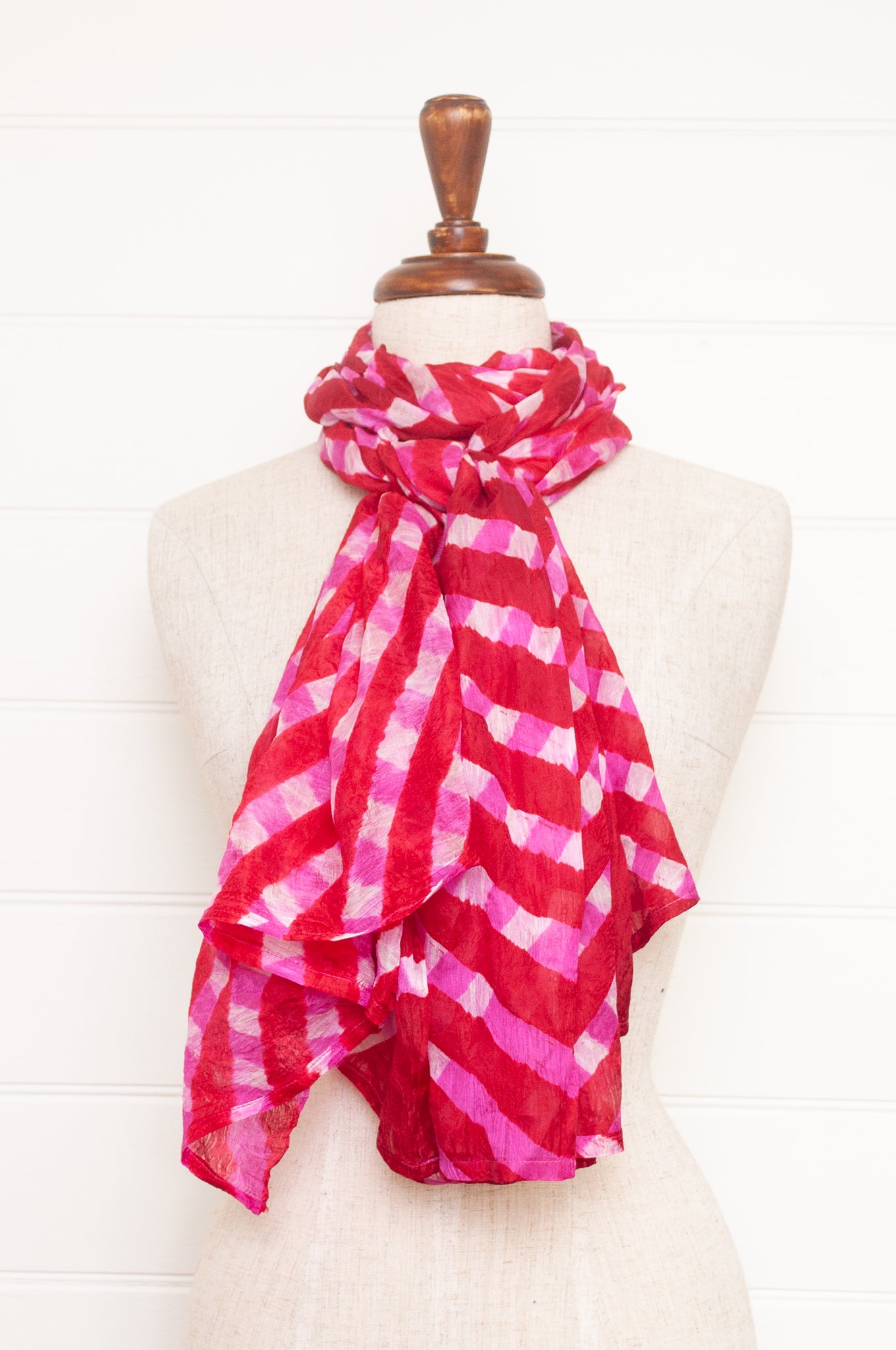 Hand painted pure silk scarf with deep red and pink checks on white.