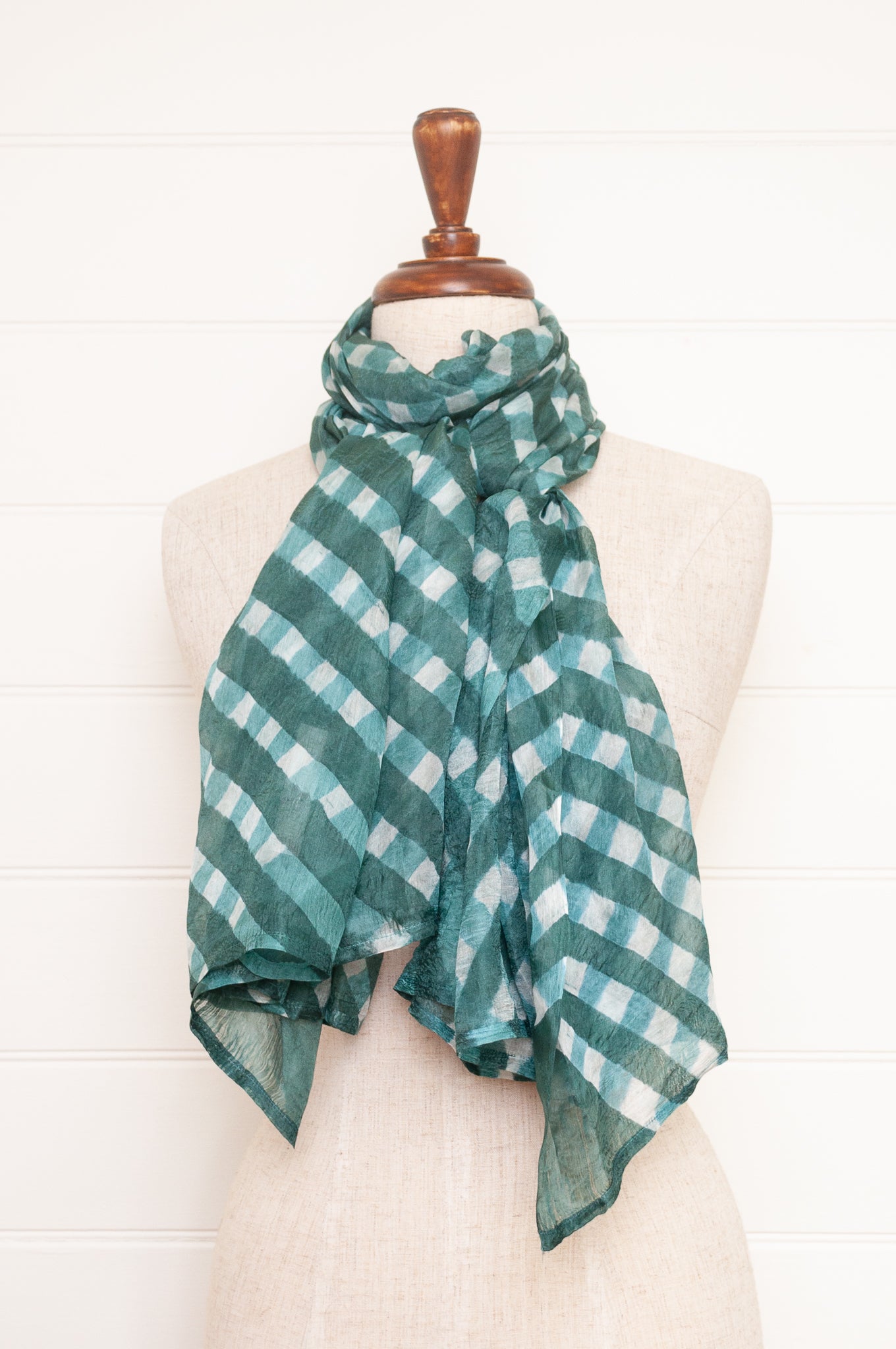 Hand painted pure silk scarf with deep turquoise green checks on white.