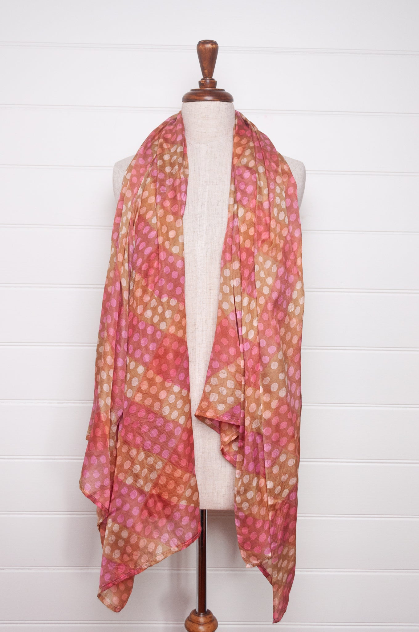 Pure silk shibori dyed  scarf in bands of pink and golden brown.