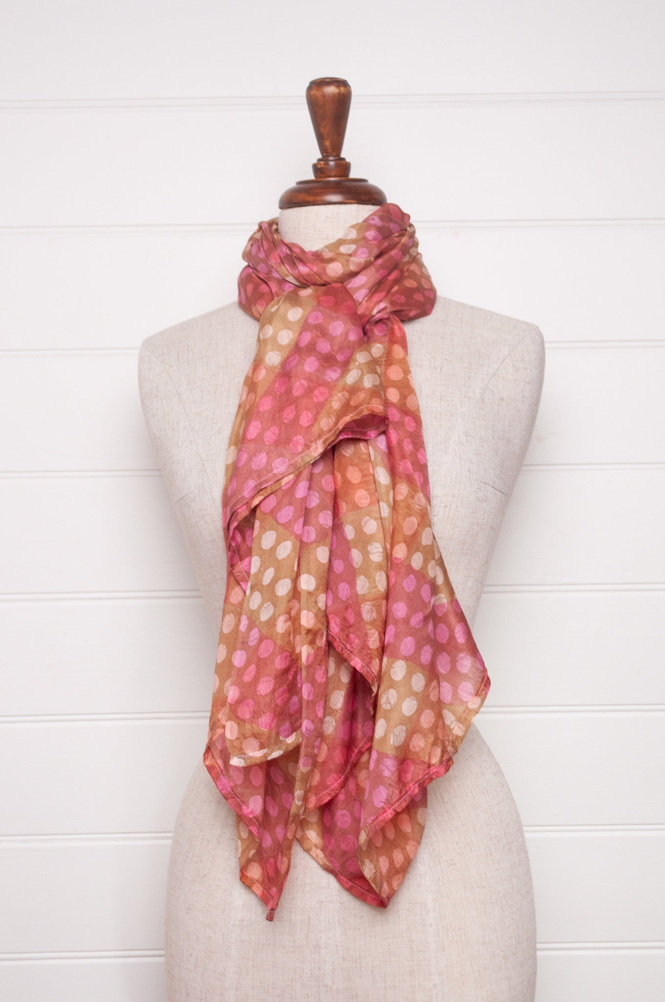 Pure silk shibori dyed  scarf in bands of pink and golden brown.