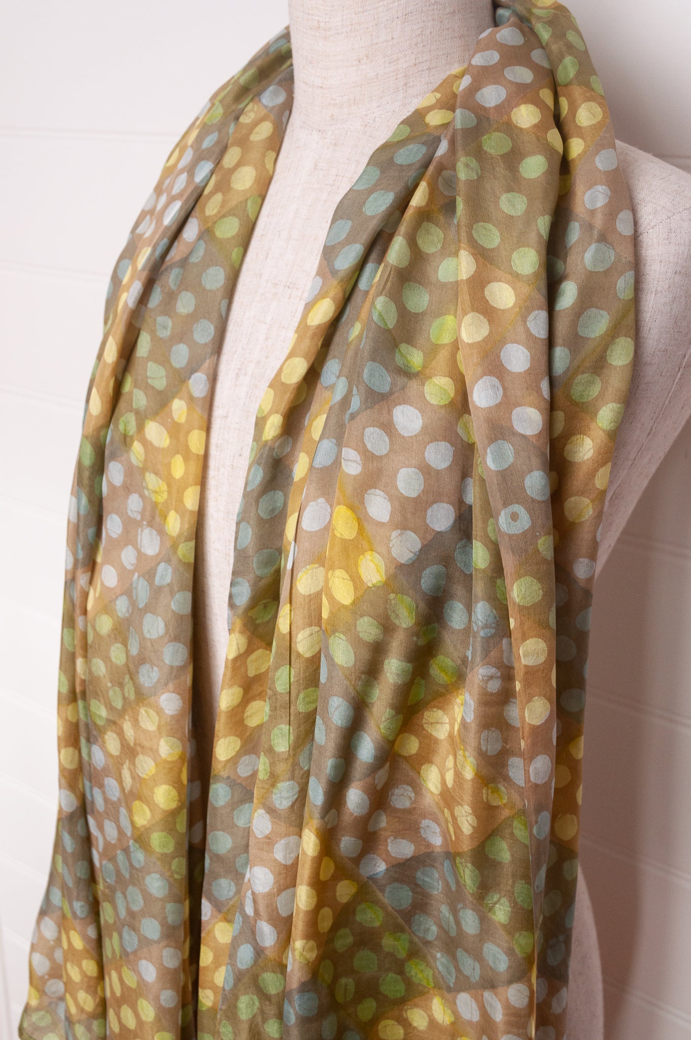 Pure silk shibori dyed  scarf in bands of aqua and light olive.