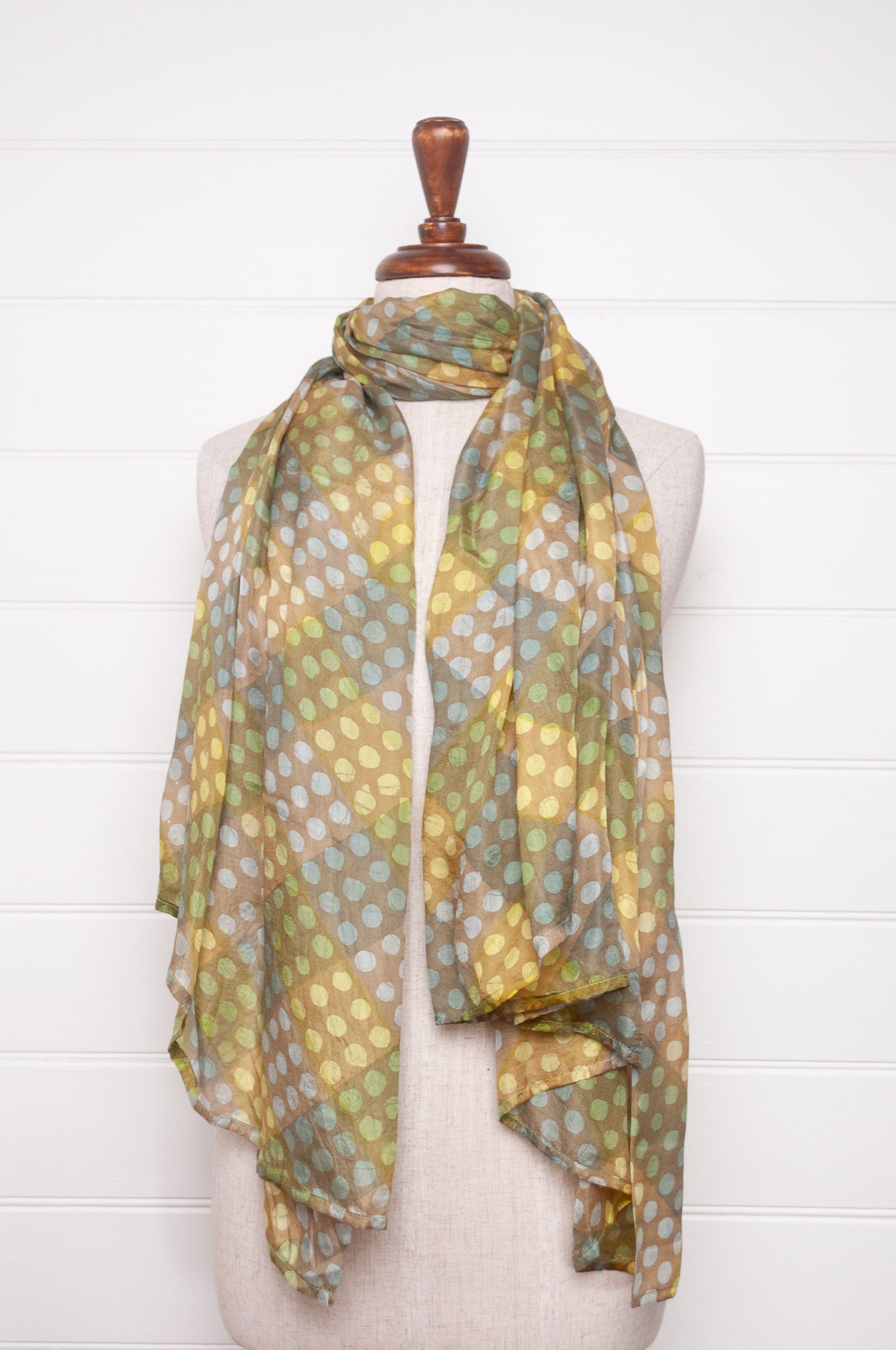 Pure silk shibori dyed  scarf in bands of aqua and light olive.